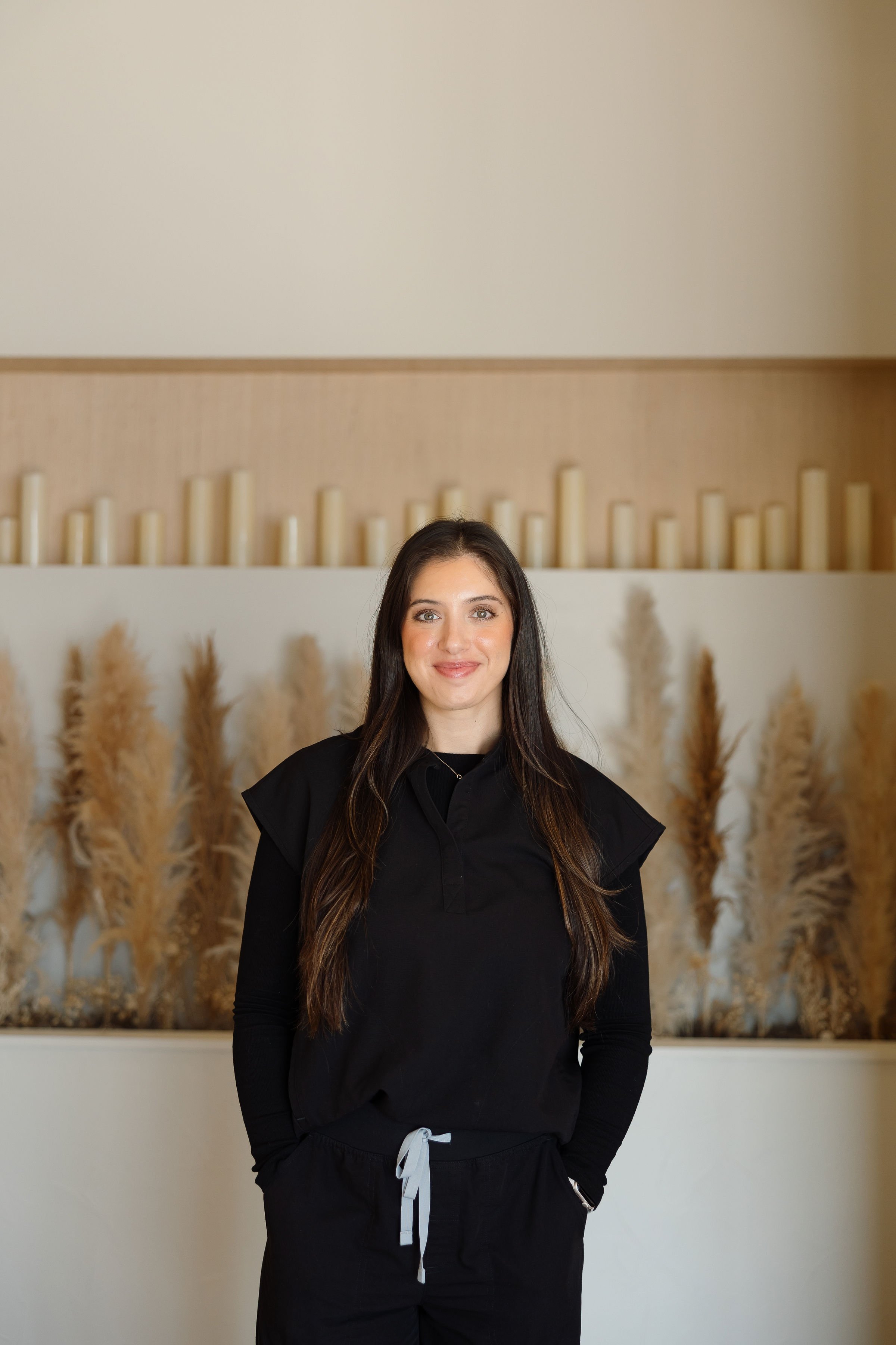 primary care practitioner in black scrubs who does hormones and primary care in Owasso