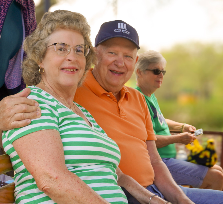 Older adults smiling together at an LCAP community event