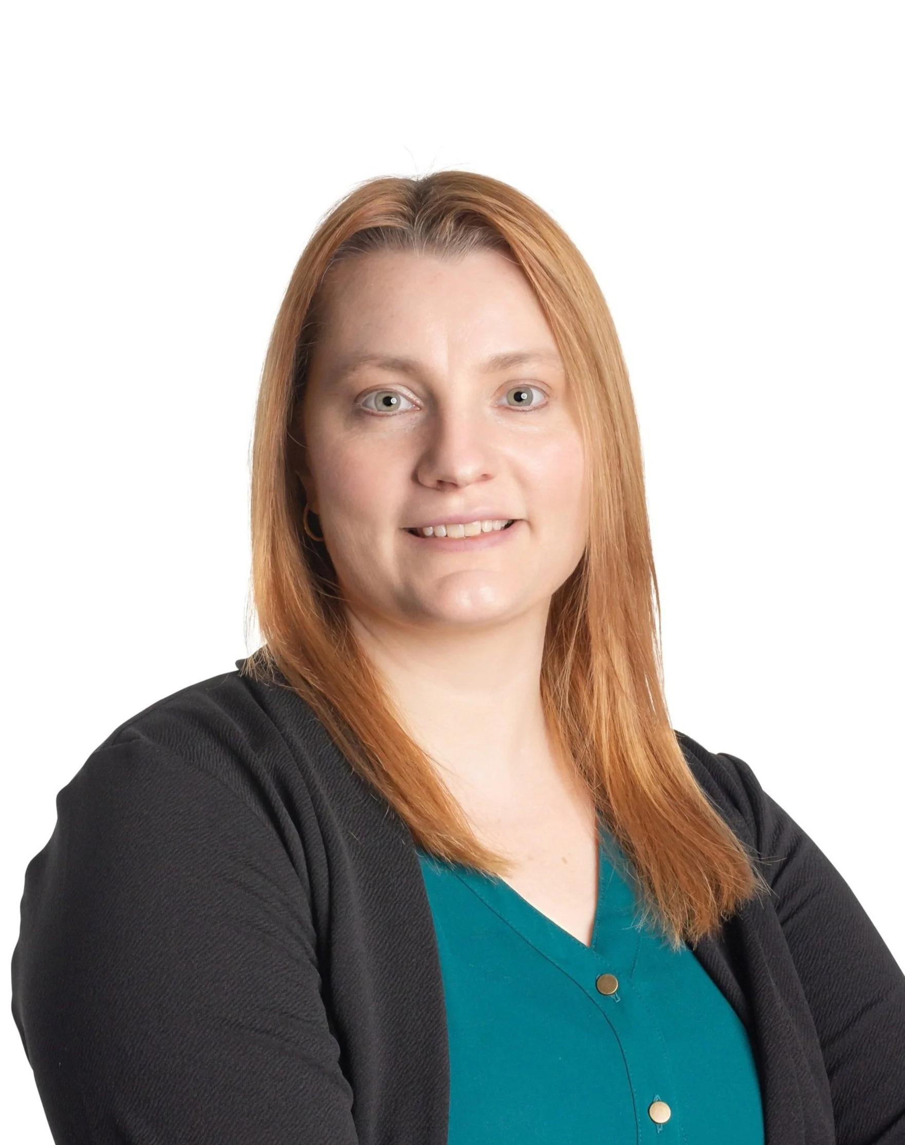 Person with long auburn hair wearing a black cardigan and teal shirt, smiling.