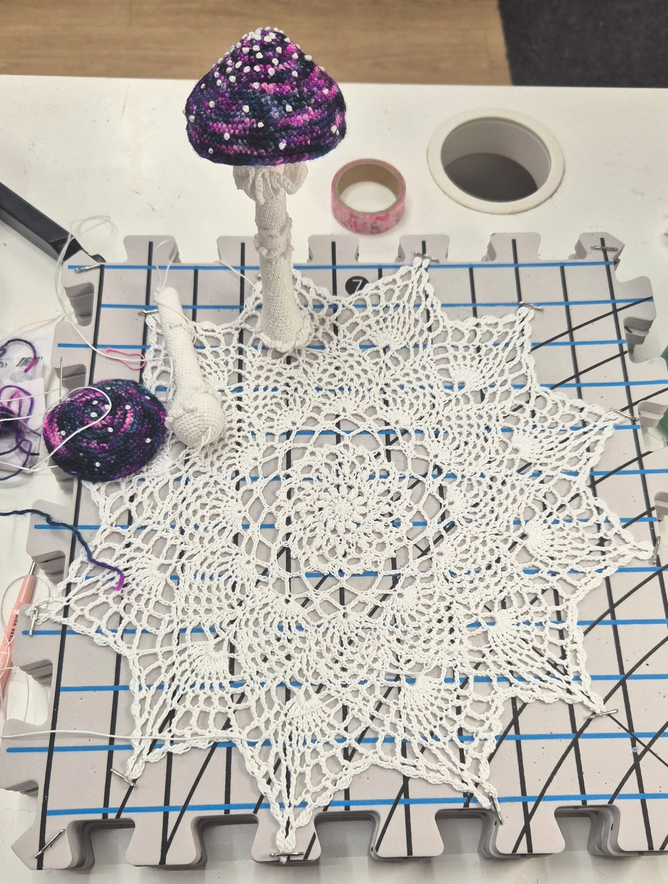 Hand-crocheted doily and mushrooms to which more mushrooms and photos from my childhood in the 7-storey flats on Shangan Road will be attached. The white doily represents the harmony present in mycelial and mycoremediated micro-ecologies