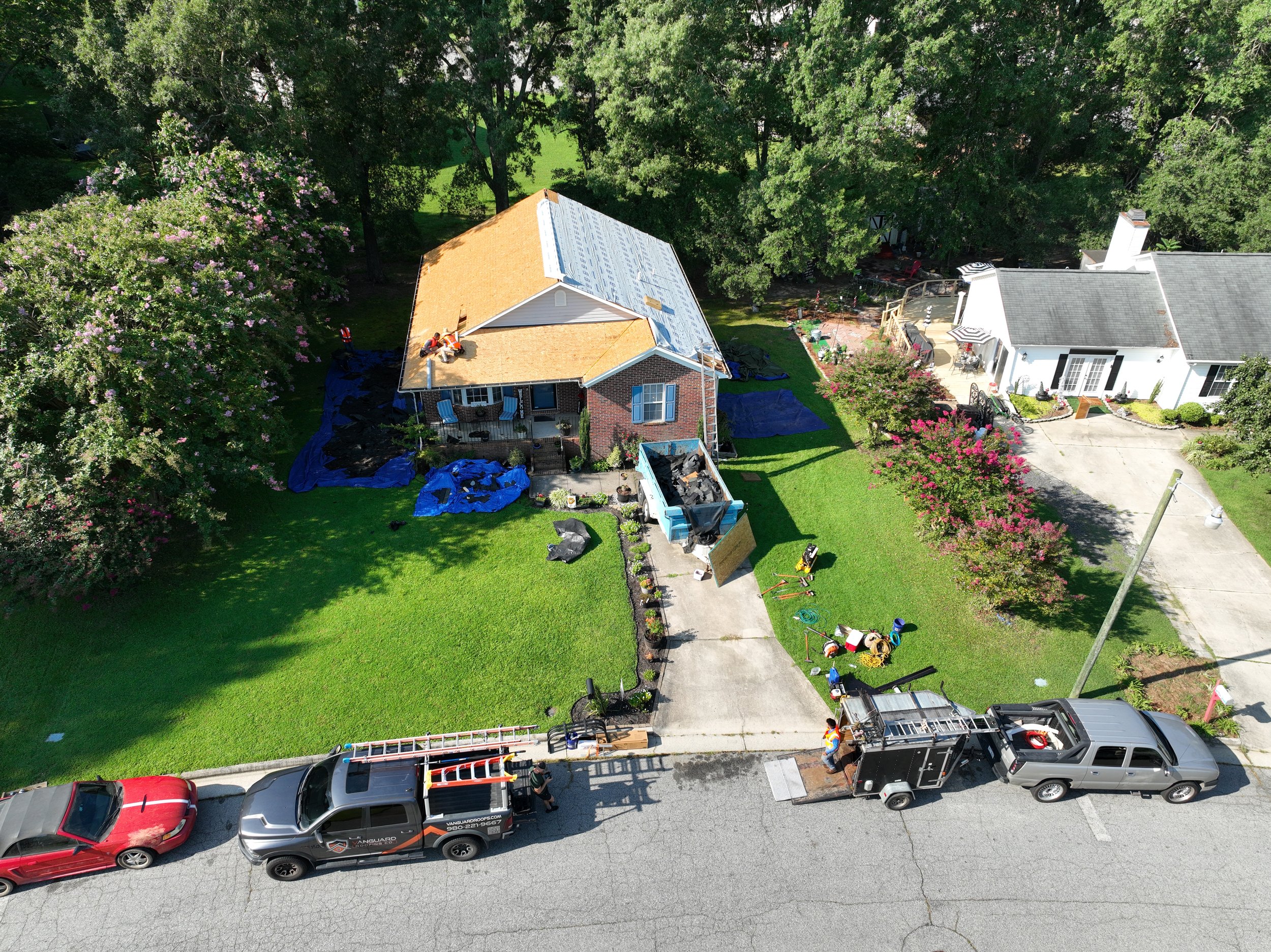 Vanguard Roofing co. expert roofing team executing a full roof replacement using premium materials and advanced underlayment techniques.