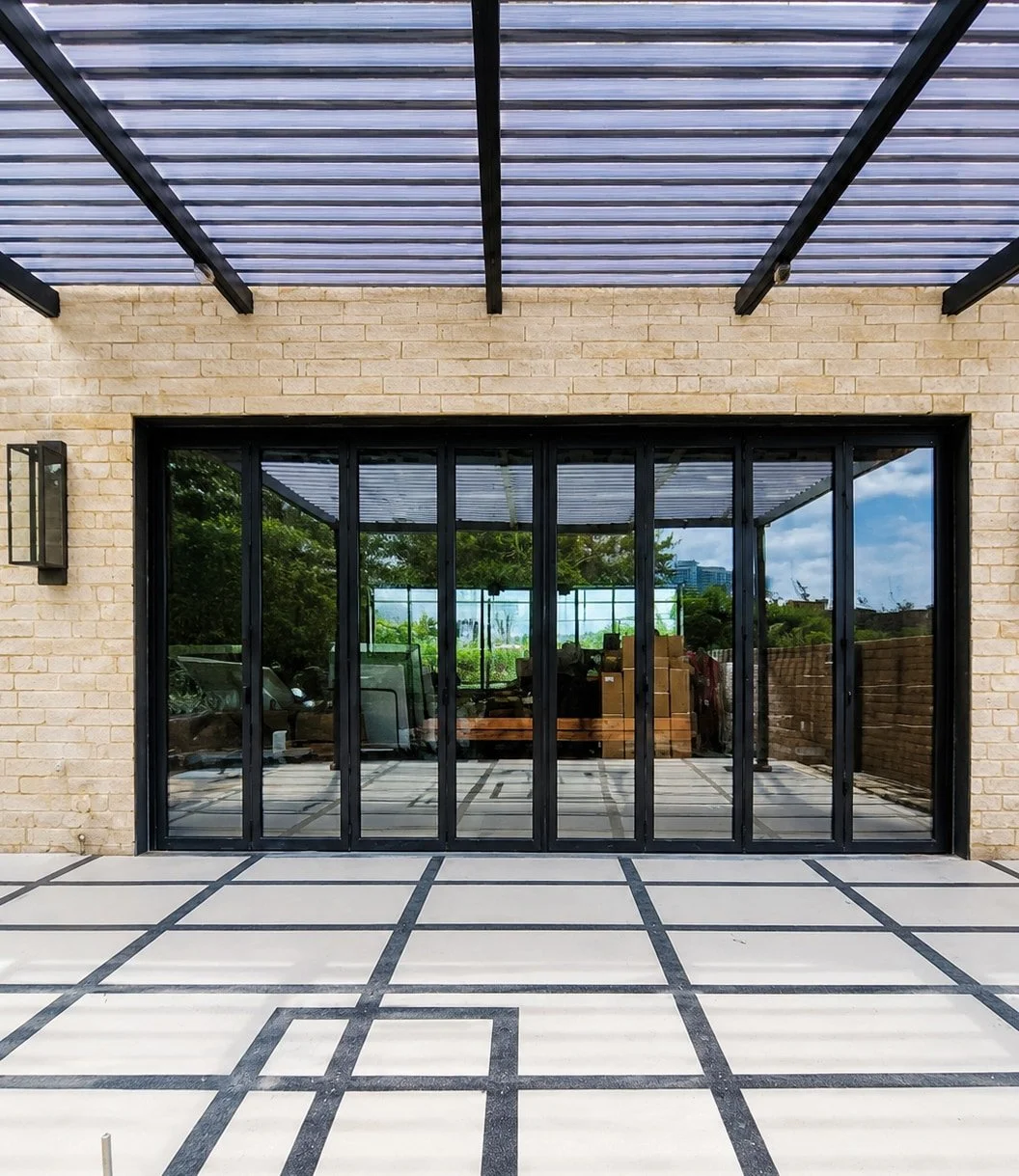 A 24-Foot Aluminum Bi-Fold Door for Wendover Art Studio in Dallas