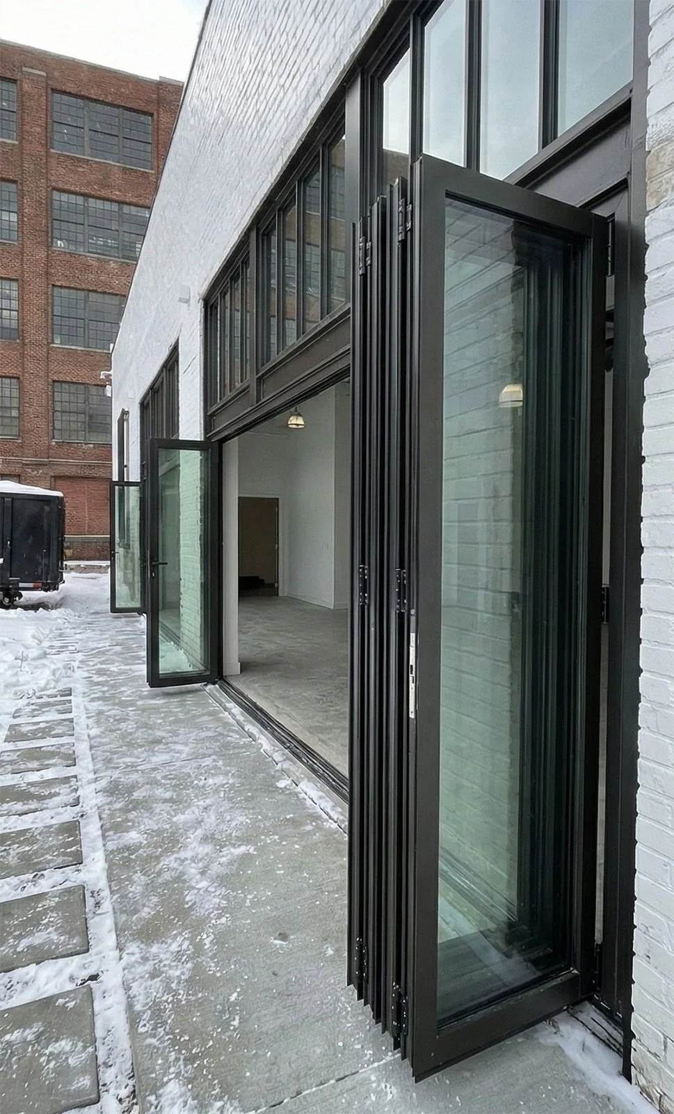 Aluminum Bi-Fold Doors for a Street-Facing Commercial Front in Buffalo, NY