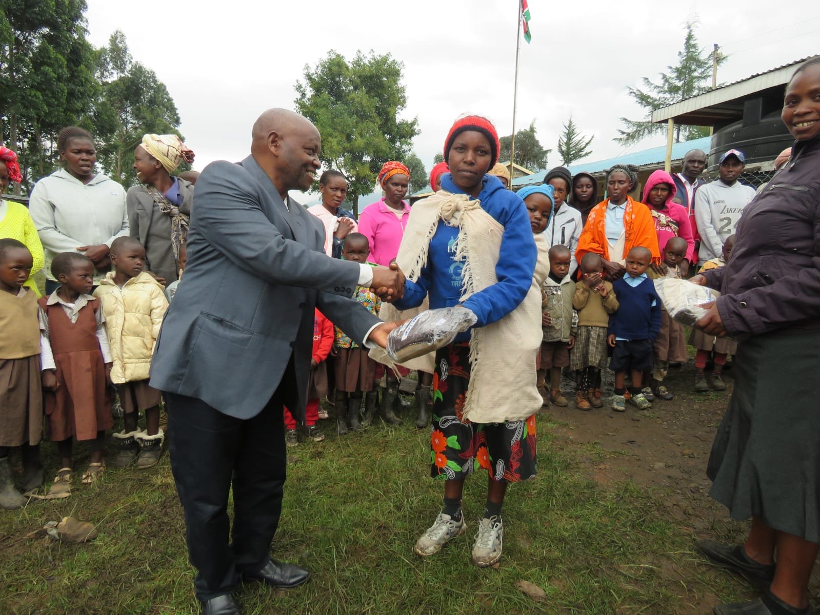 Distributing new uniforms to parents