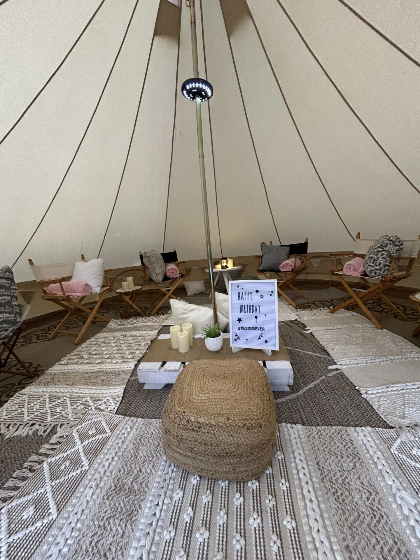 Cozy glamping hangout area with seating and lights designed for parties and outdoor events in Roanoke, VA