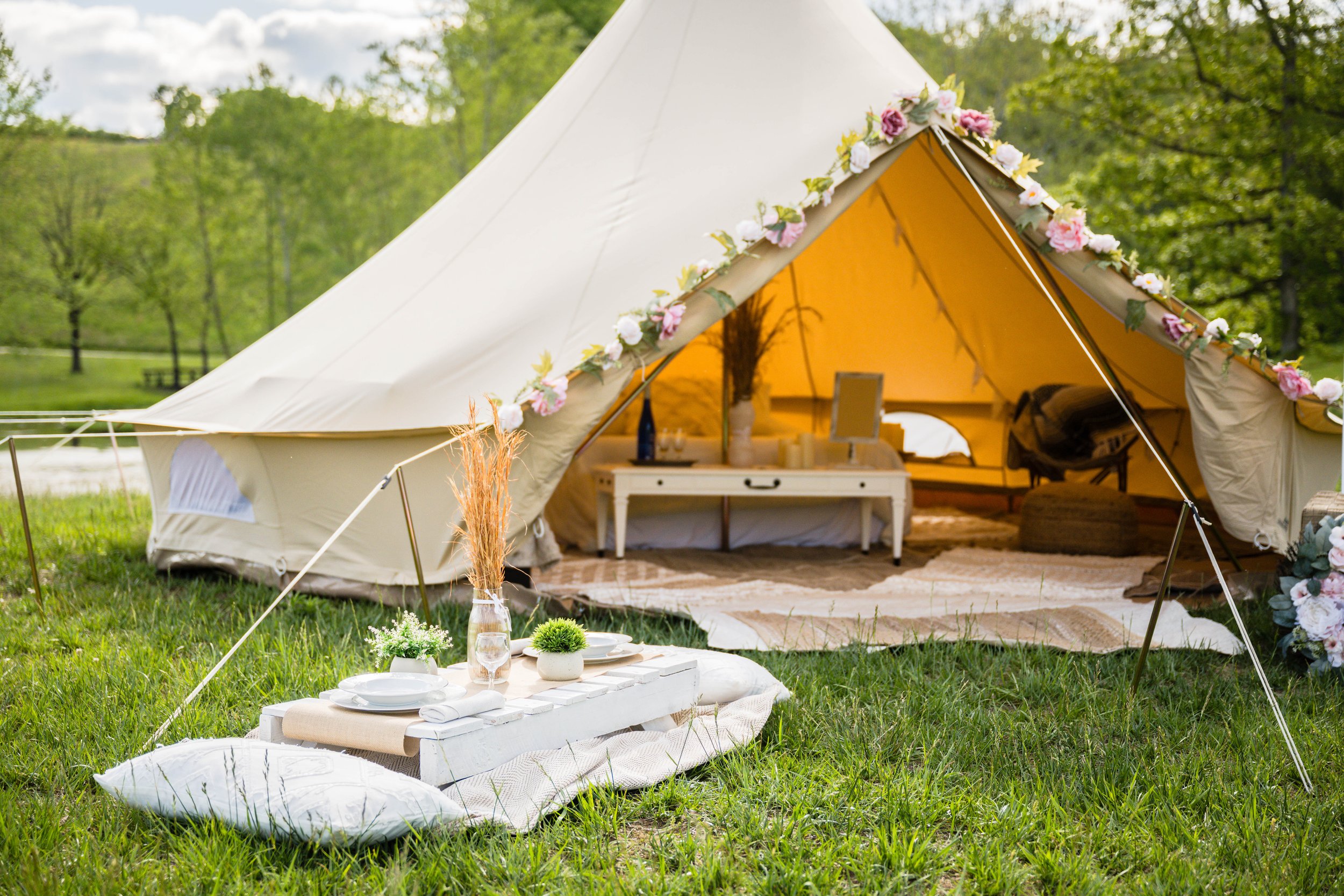 Elegant glamping tents set up for a private outdoor wedding in Roanoke