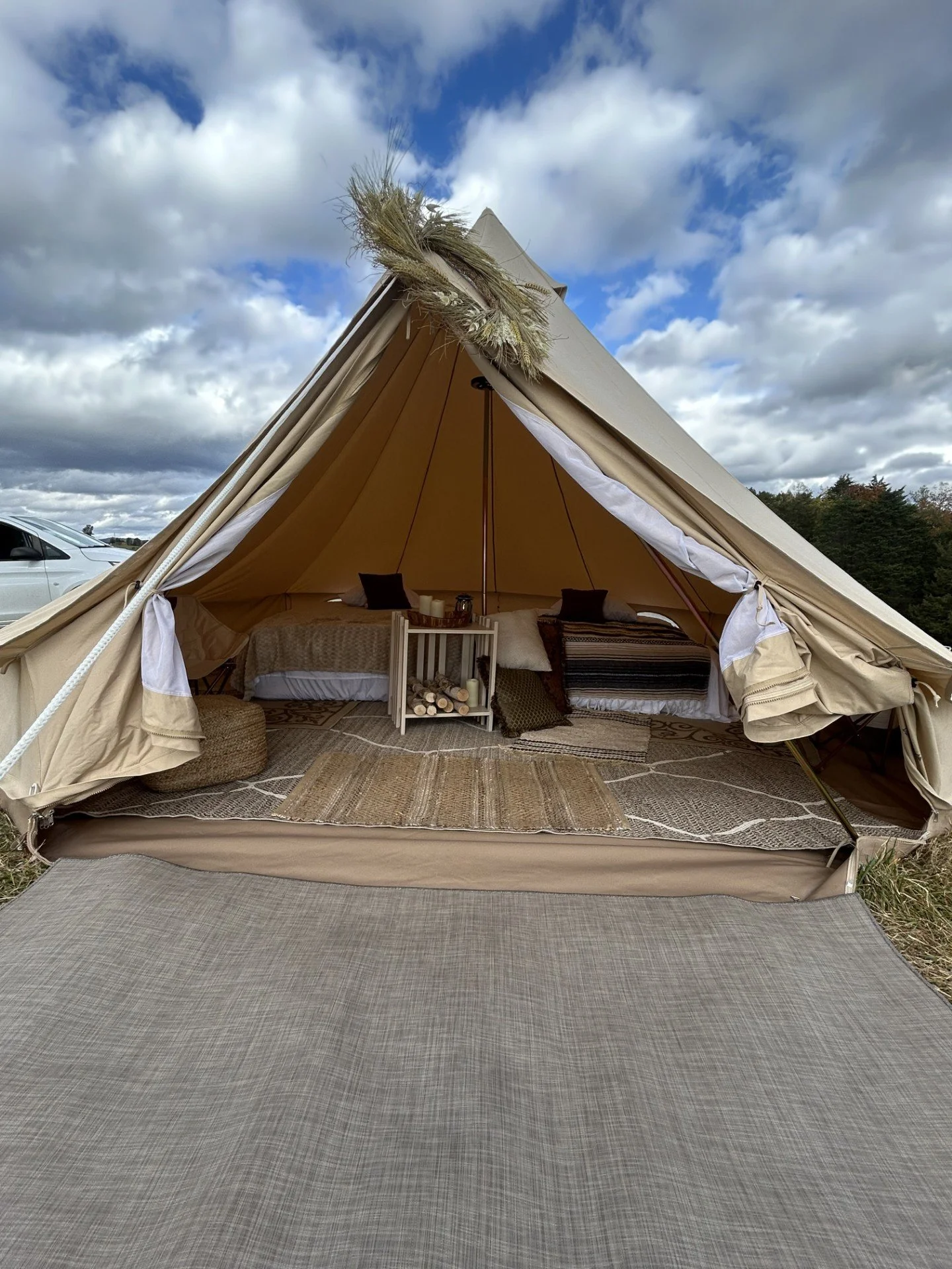 Interior of a glamping tent with multiple beds set up for a birthday celebration in Roanoke, VA