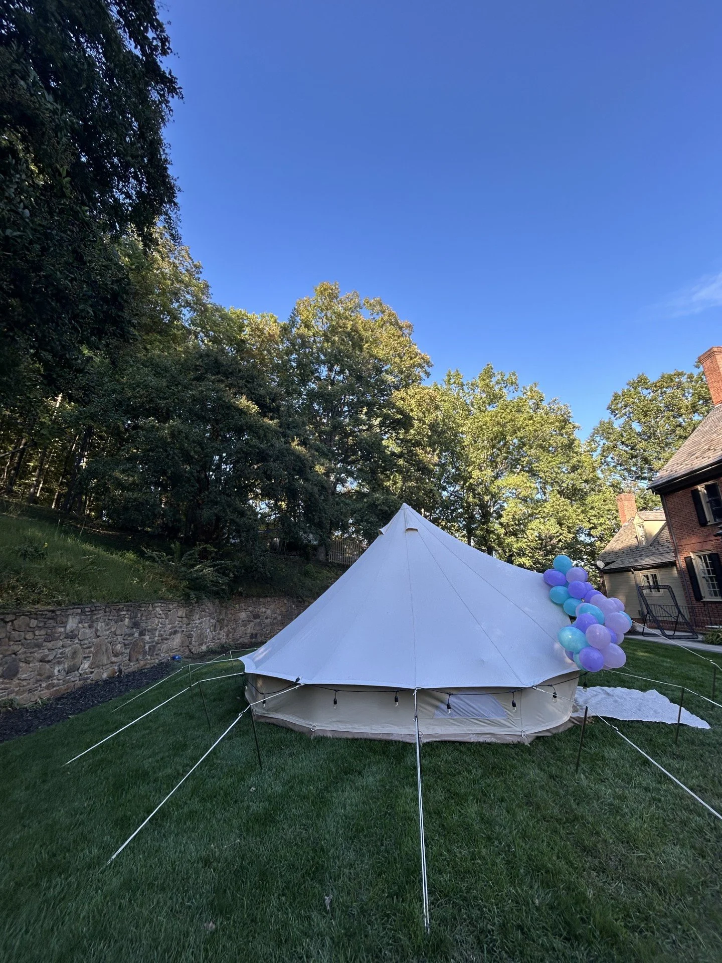 Covered birthday tent rental providing a weather-protected party space