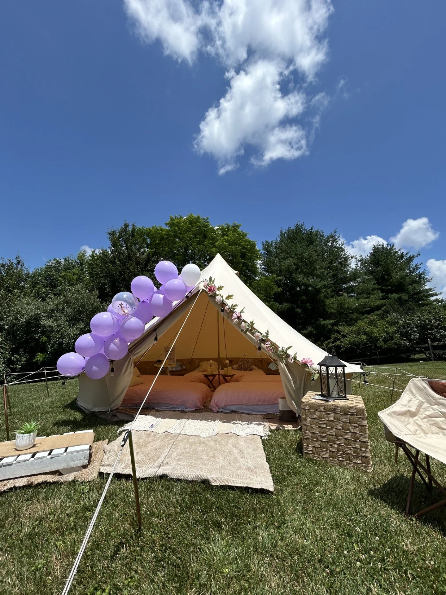 Kids birthday party enjoying a luxury tent rental in a backyard