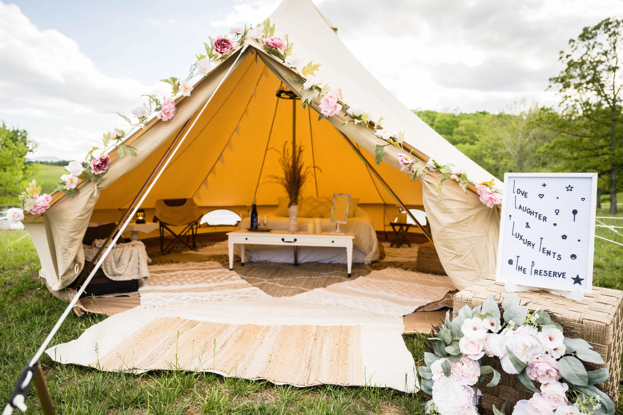 Luxury mobile wedding glamping tent with string lights at night