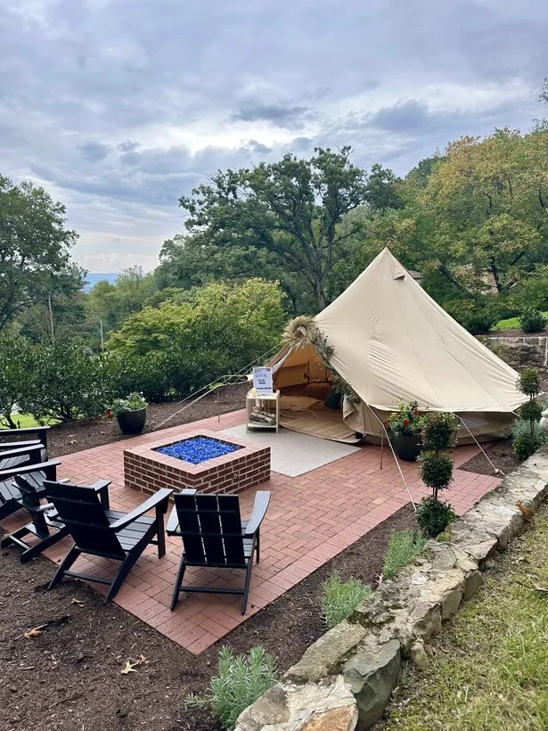 Luxury backyard glamping tent with cozy lounge setup in Roanoke