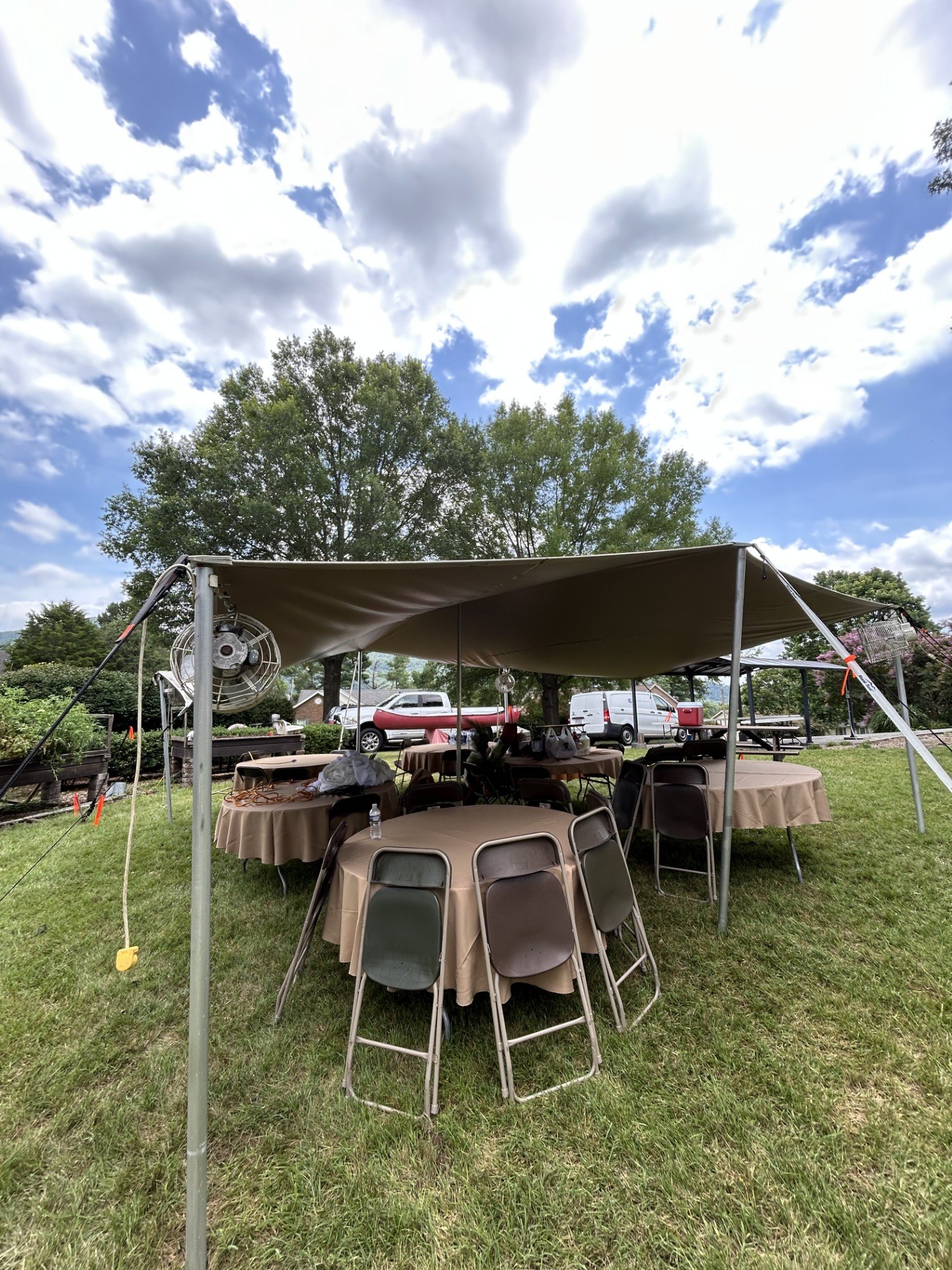 Stretch tent covering tables, chairs, and food service at an outdoor event in Virginia