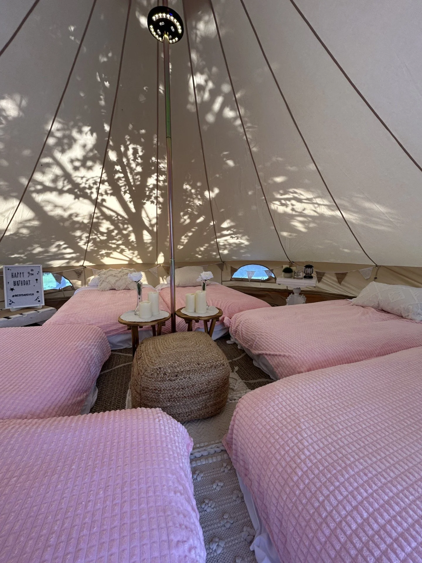 Girls birthday party glamping tent interior with cozy twin beds in Roanoke, VA