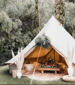 Styled interior of a wedding glamping tent designed for comfort and relaxation
