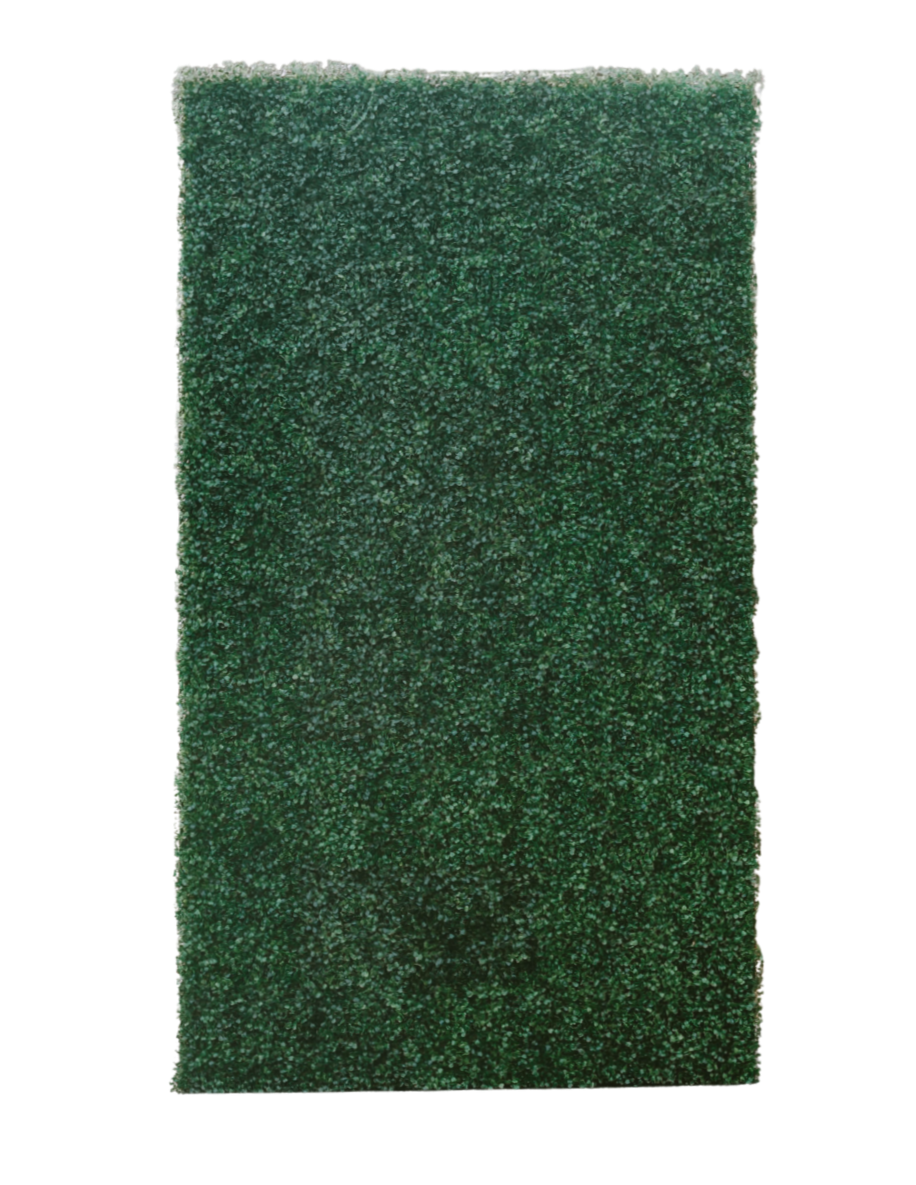 A green scouring pad with a rough and porous texture.