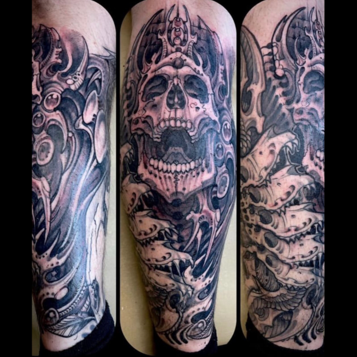 skull-biomechanical-arm-sleeve-tattoo.png