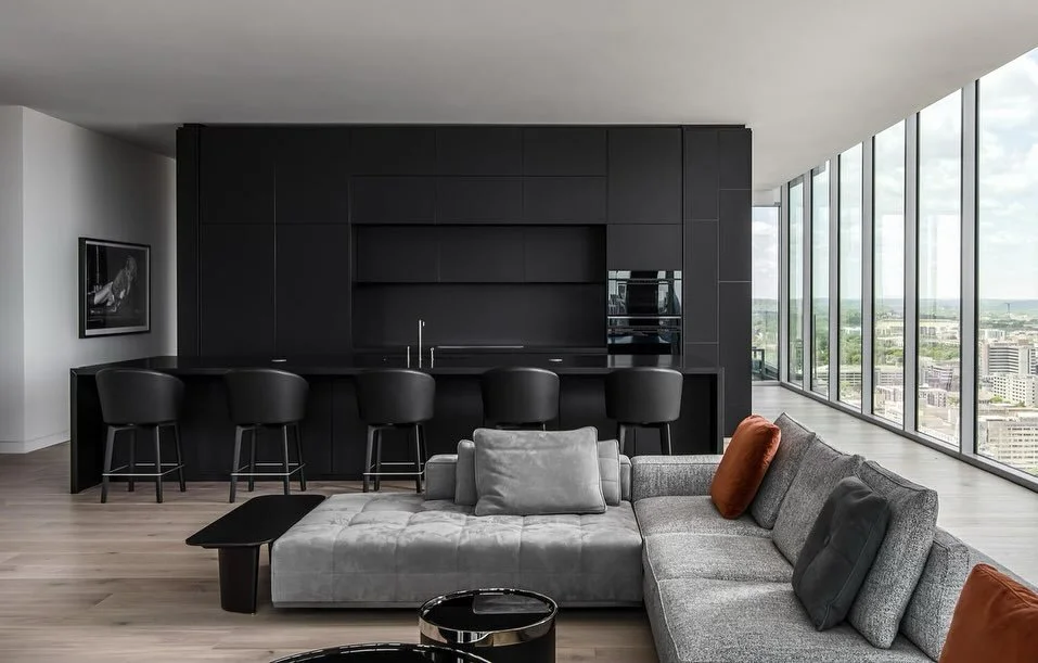 Black glass cabinetry =  edge &amp; sophistication 🔥

Built by: @oxfordshepard 
Designed by: @lucalanzetta_official 
Photos by: @studiobuell 

#Nashville #InteriorDesign #Penthouse #Kitchen