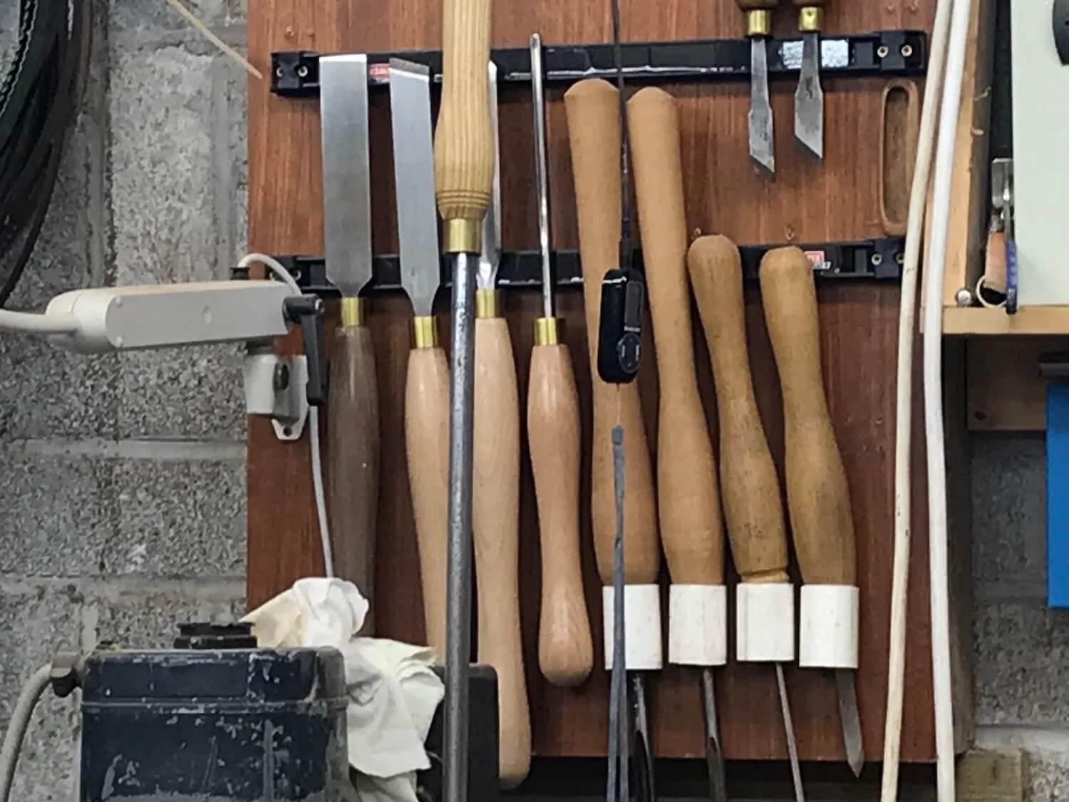 tools used in harp making hanging on the wall