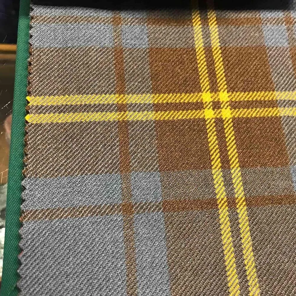 brown, yellow, and gray tartan fabric