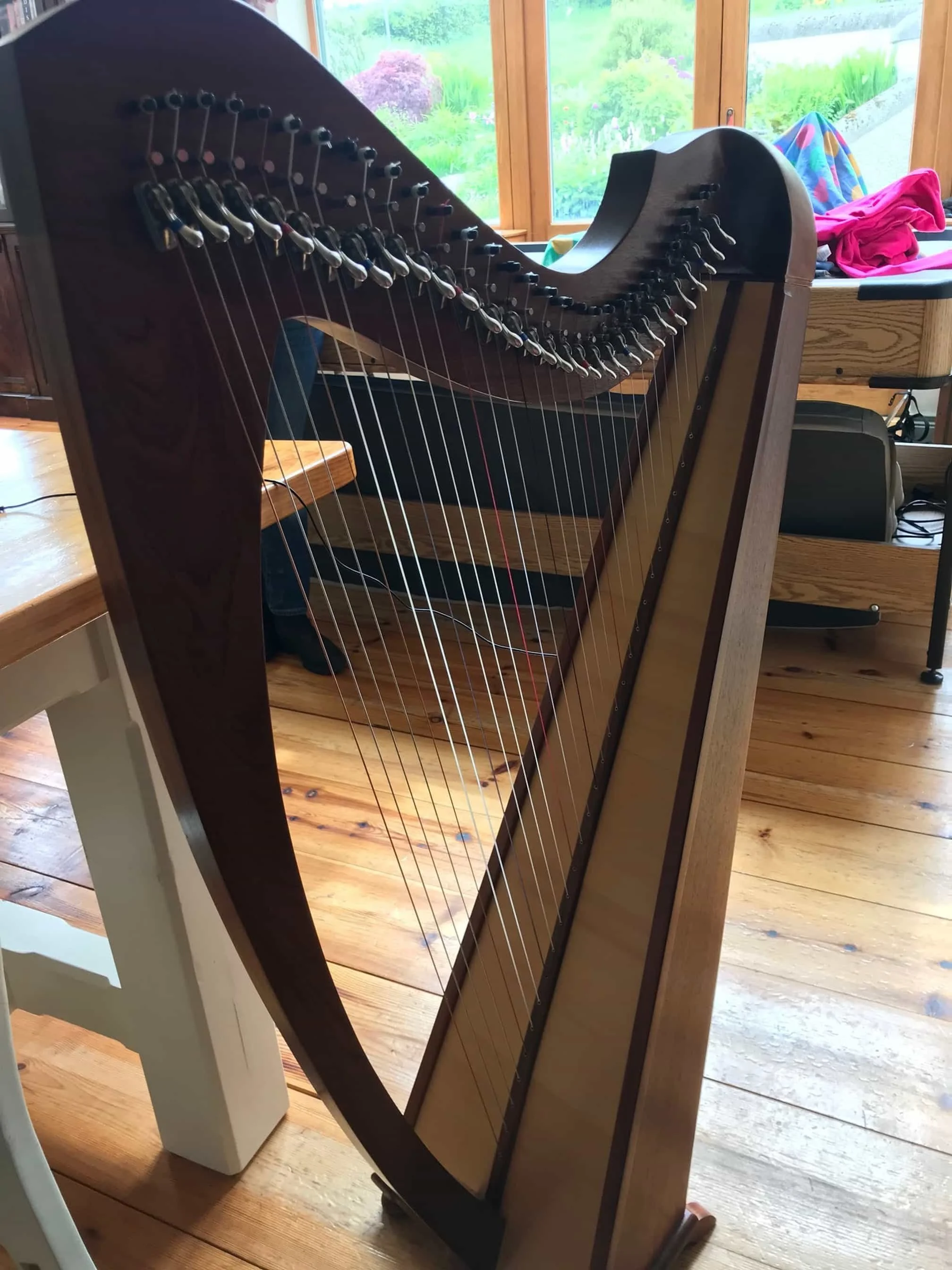 HollyTree harp standing in the workshop