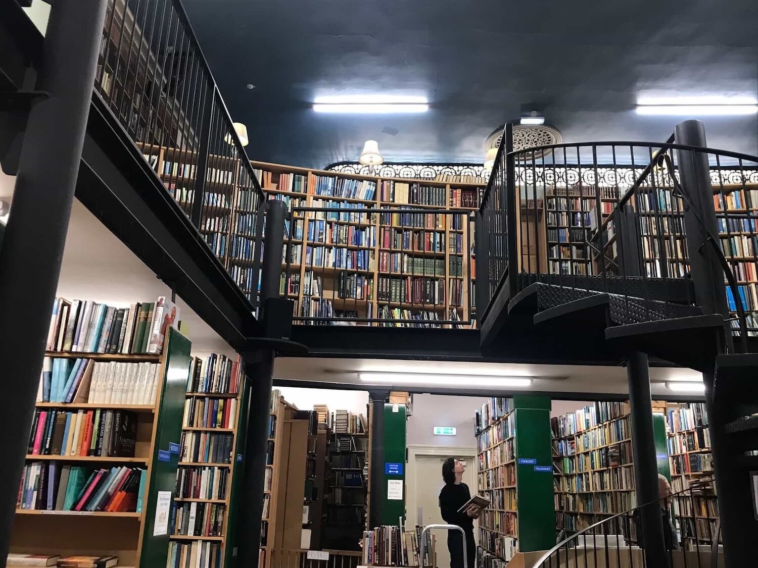 looking up from the first floor of Leakey's Bookshop there are shelves filled with books