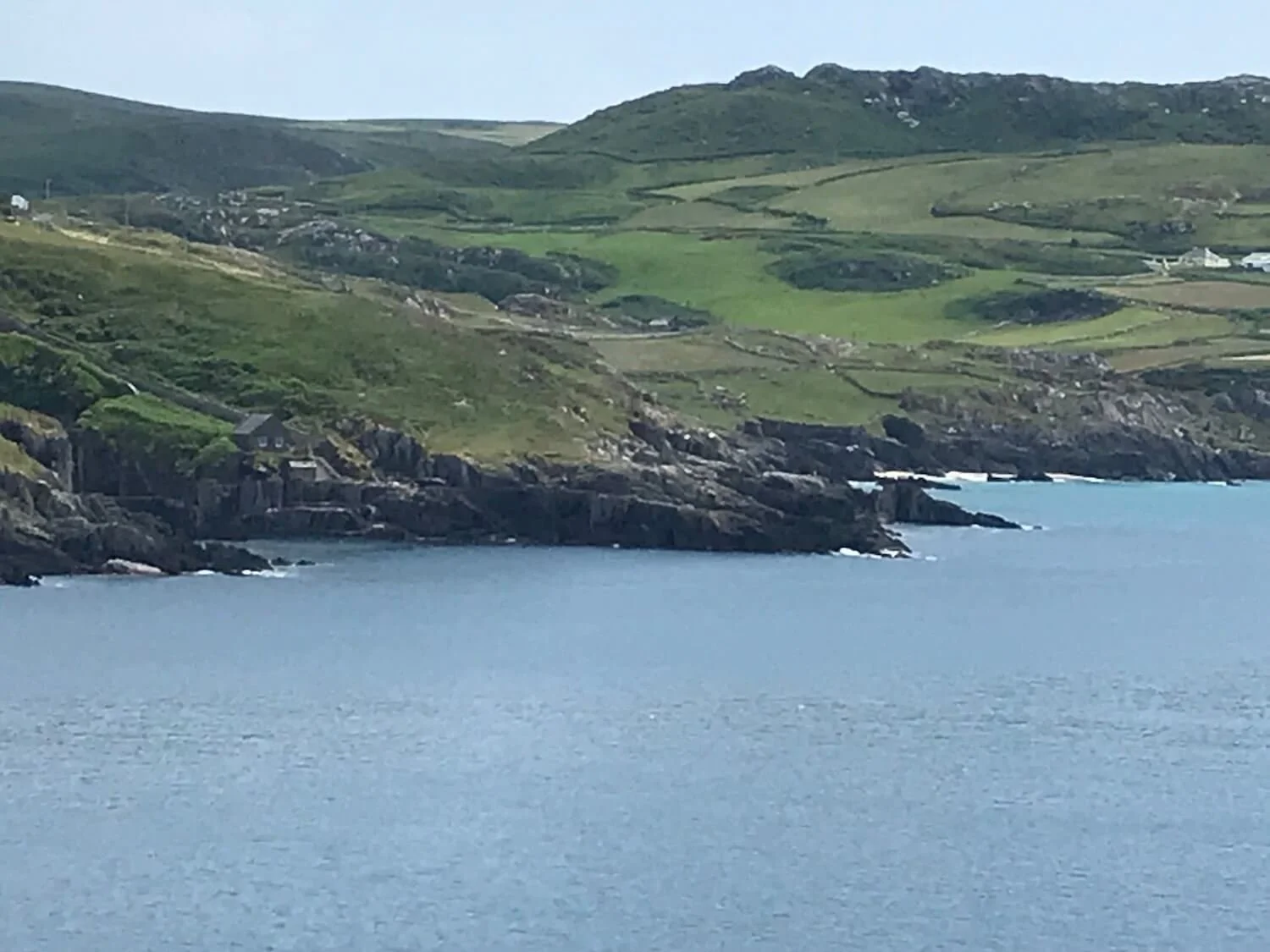 View from Dursey Island shows water and green hills in the distance