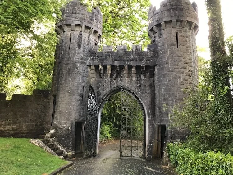 Ashford Castele Archway surrounded by greenery