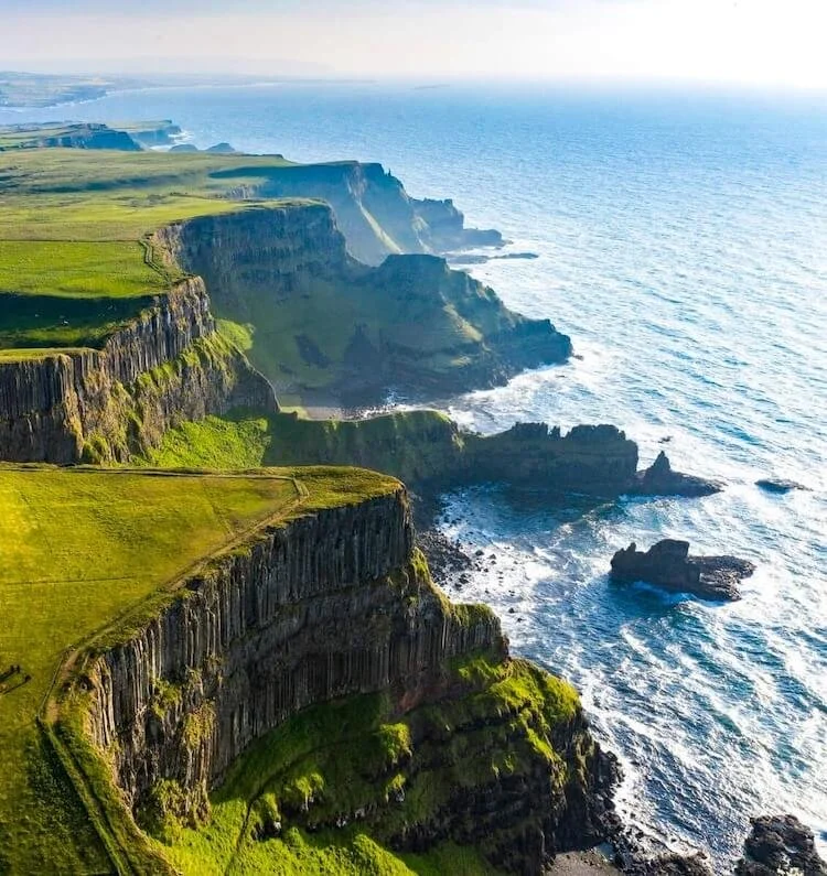 Green cliffs and ocean in Ireland