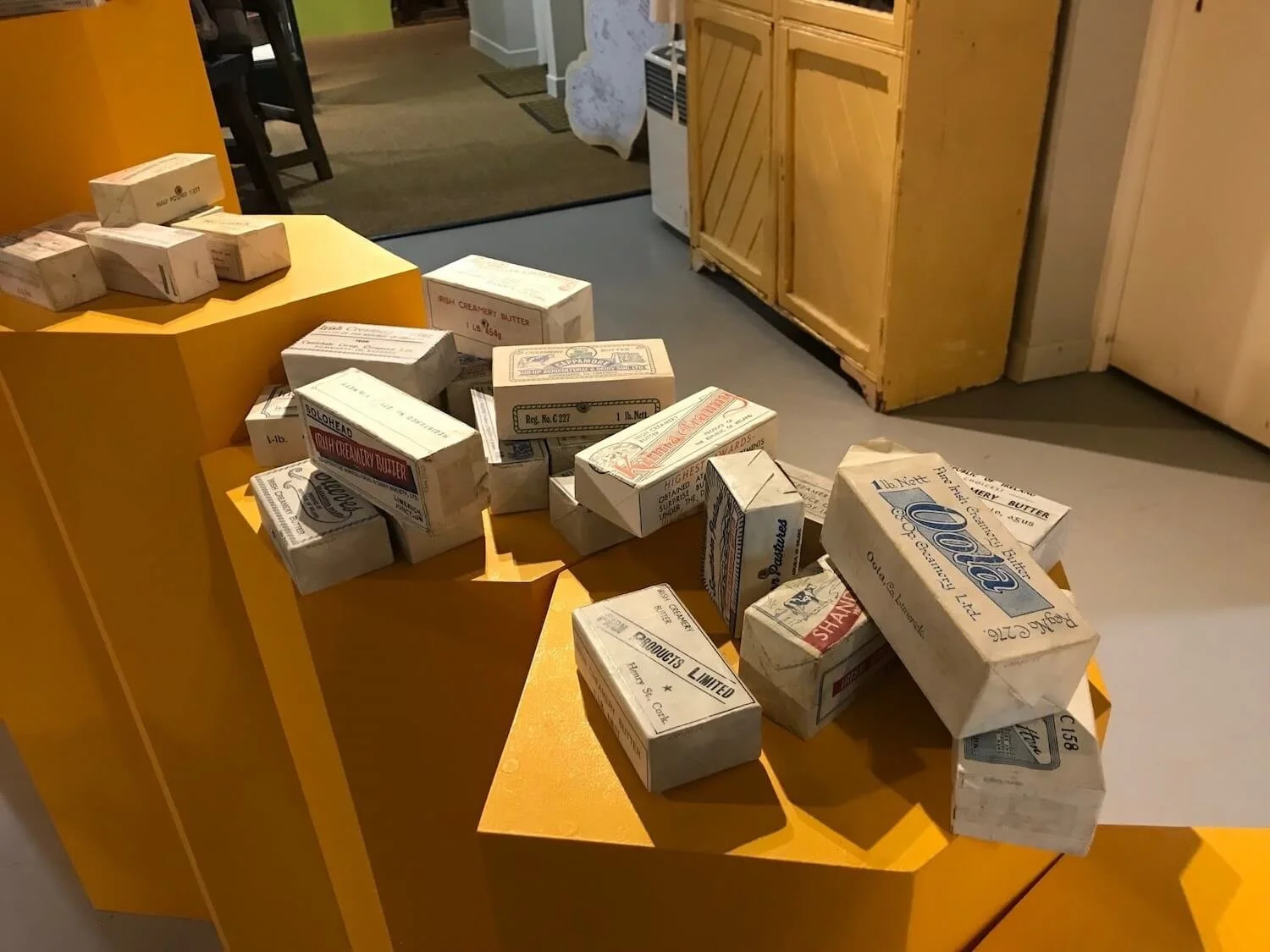 museum display of multiple butter packagings