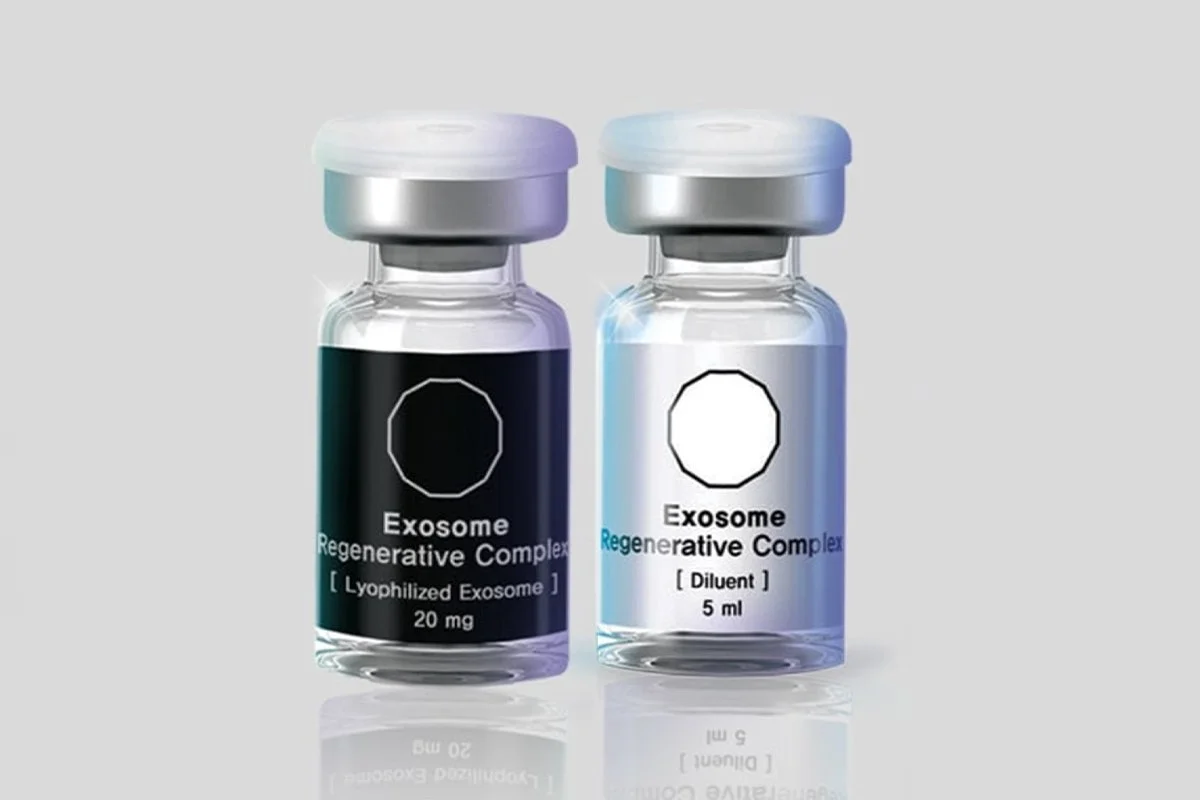 Two vials labeled 'Exosome Regenerative Complex,' one with a black label indicating 20 mg of lyophilized exosome and the other with a clear label indicating 5 ml of diluent.