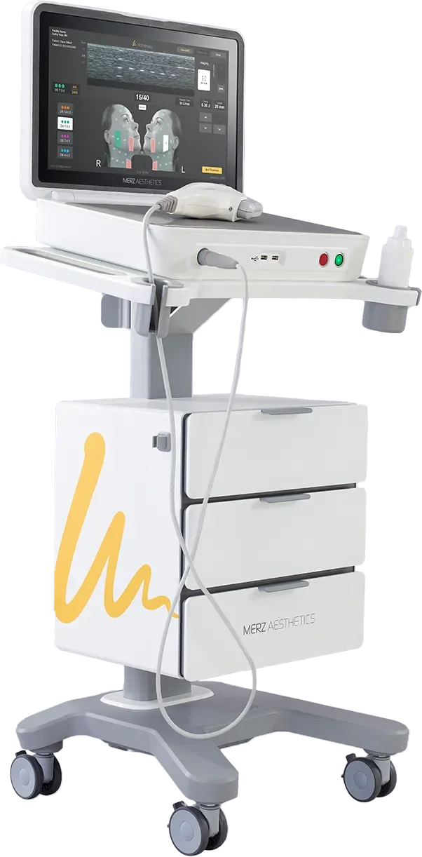 A medical device on a wheeled cart with a large touchscreen monitor displaying a facial ultrasound or skin imaging scan, attached to a handheld probe, with drawers below and various controls on the side.