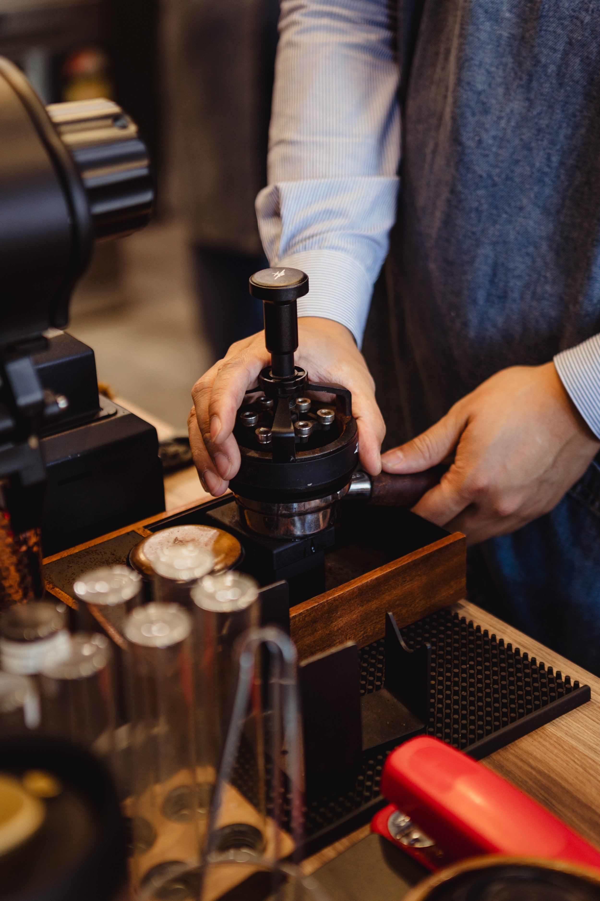 A shot of espresso is being pressed 