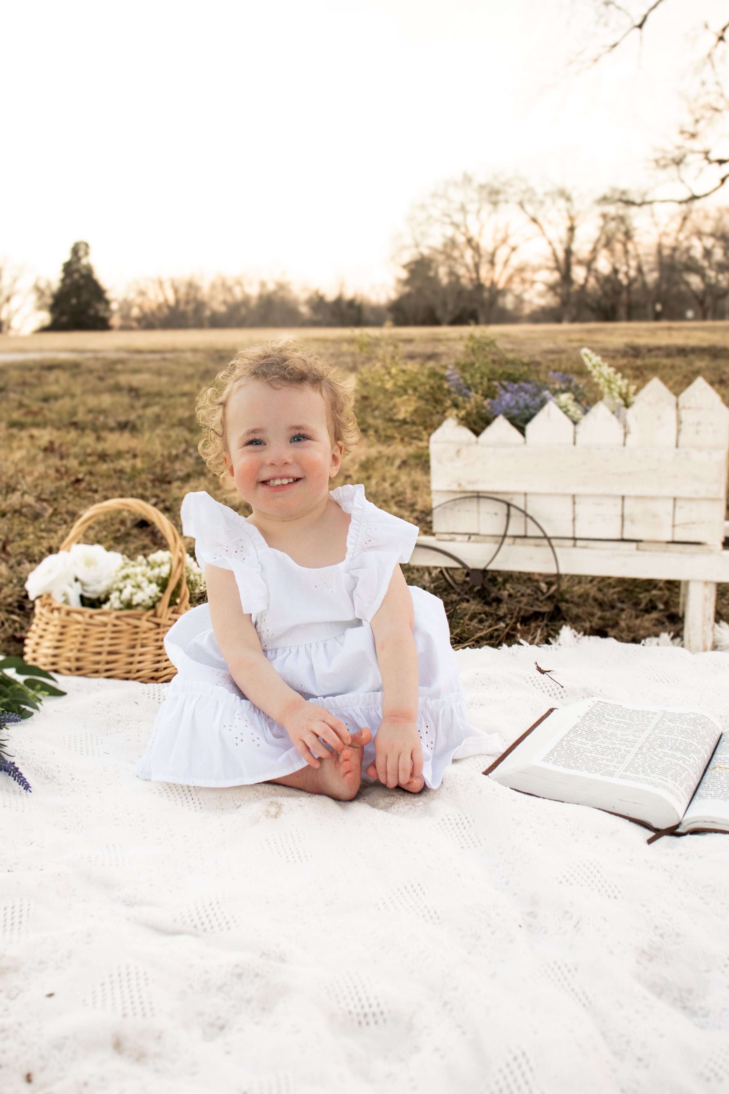 Easter mini session located in Paola Kansas. Photo of a sweet little 2 year old in light and airy lighting.