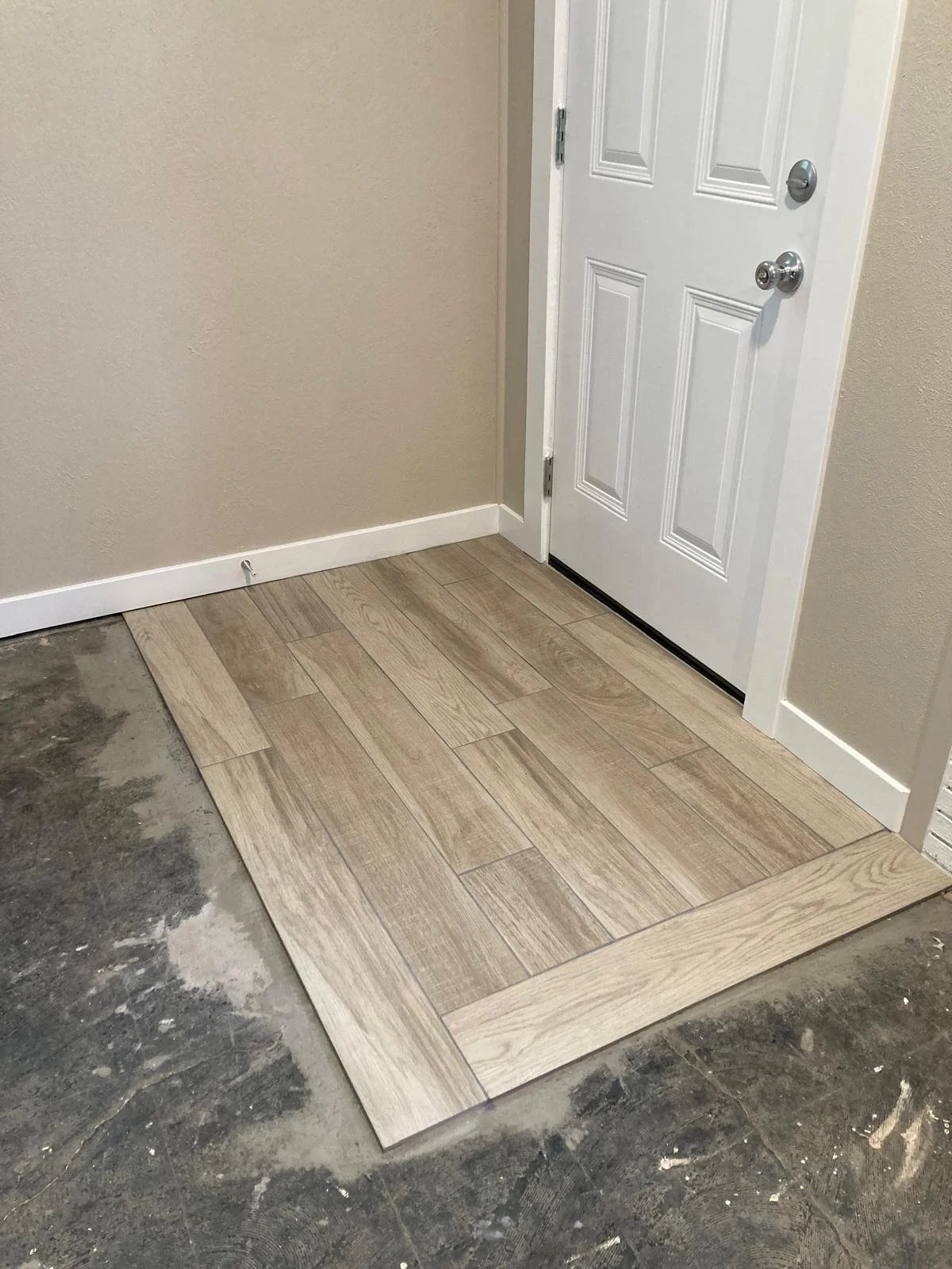 Tile floor landing, baseboard install, paint door