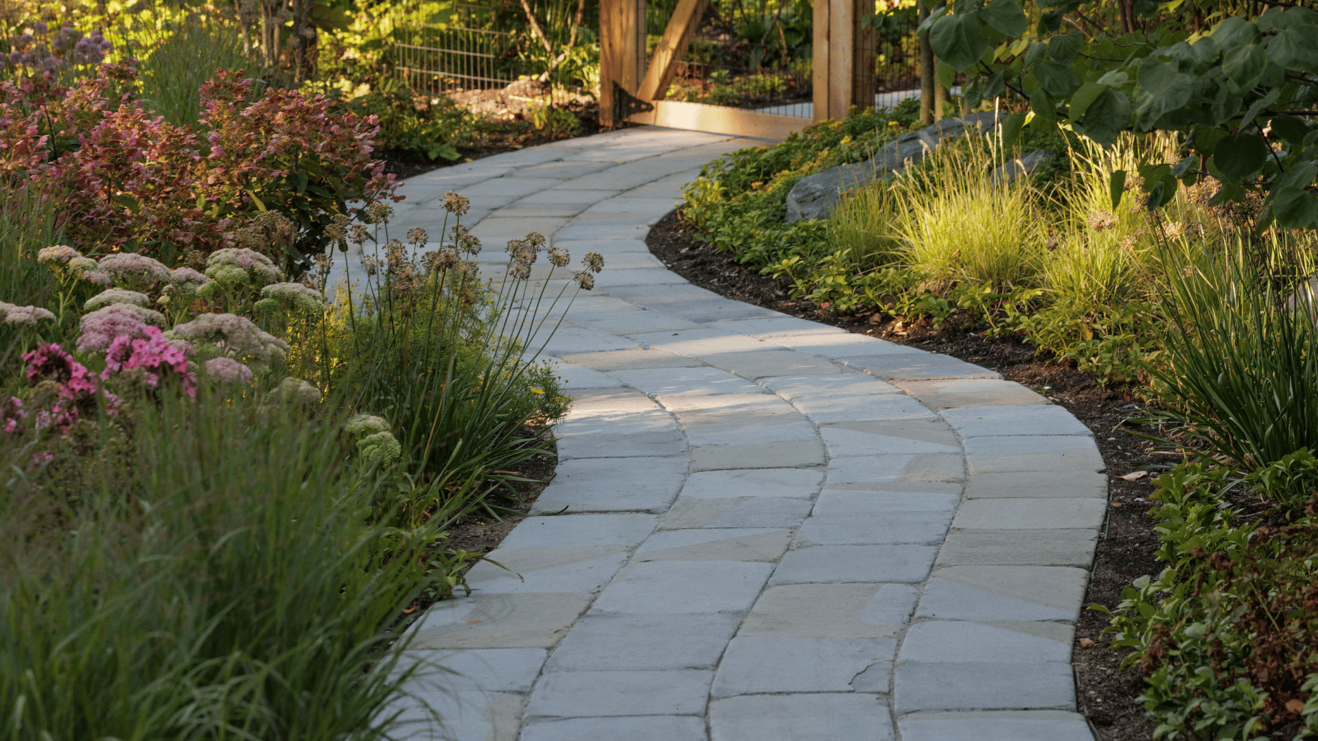 Riverwoods IL Boulder Accent Planting Bed Along Stone Pathway Near Gate pappas company construction landscape design rosin residence hardscaping