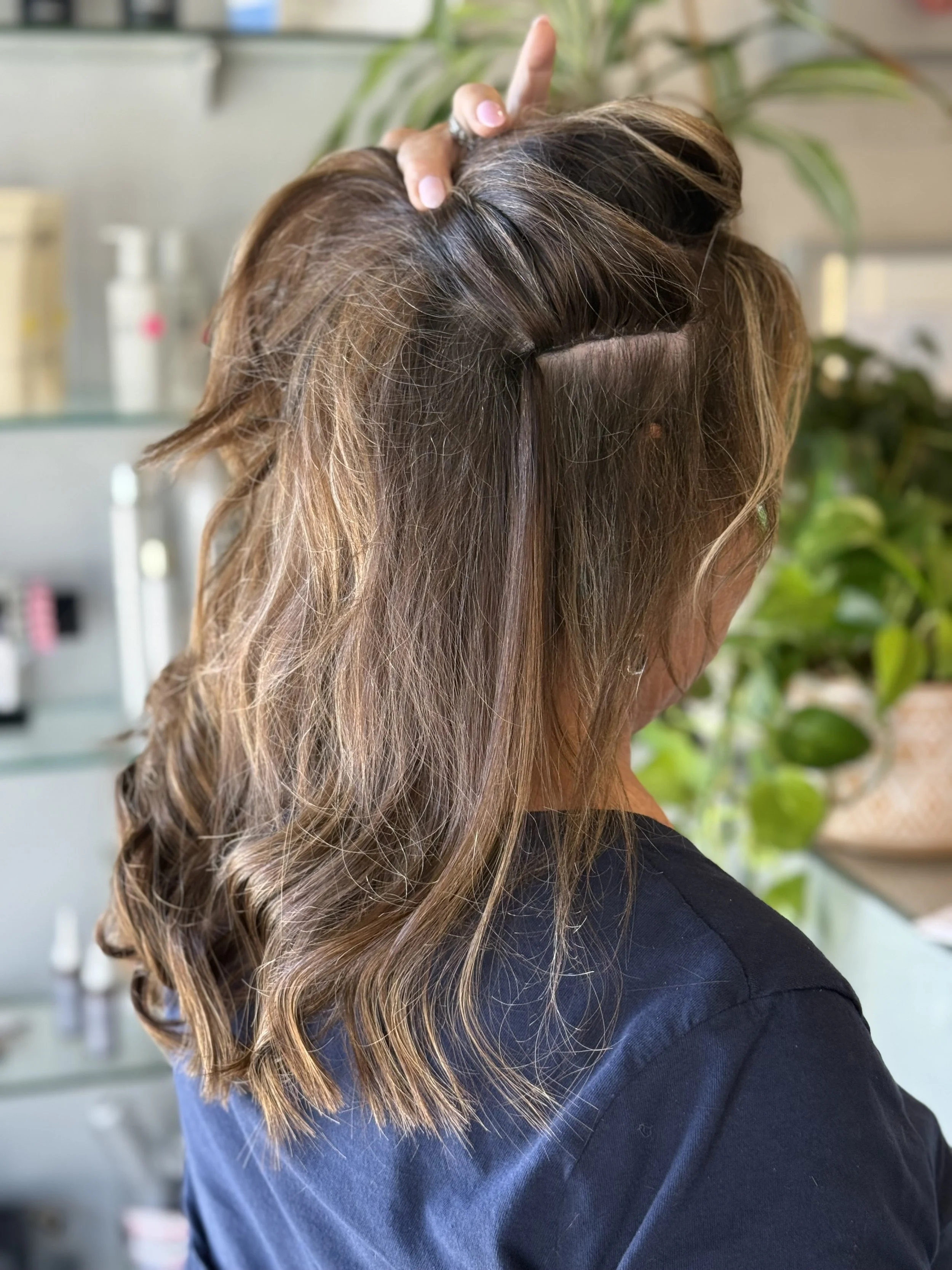 The "under the hood" work of Sydney Pascoe's hair extensions.
