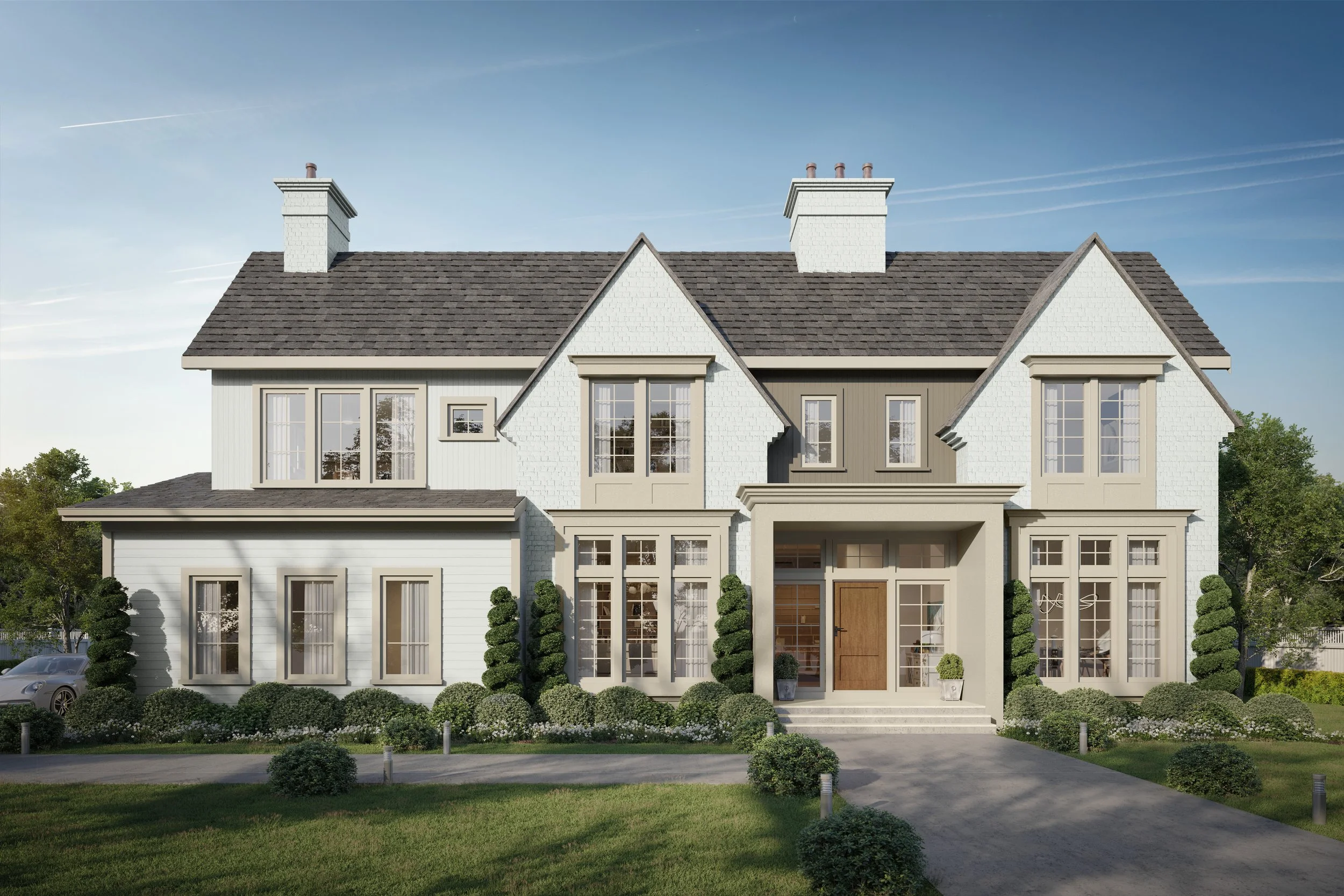 A modern two-story house with white and gray exterior, large windows, and landscaped front yard with bushes and trees.