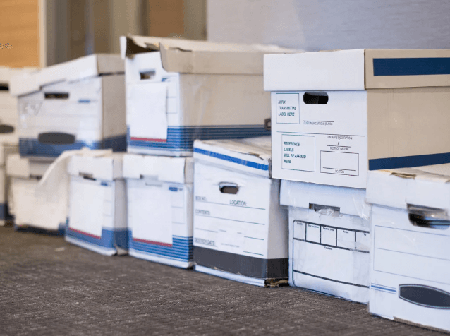 Old file boxes ready to be shredded, prepared for a shredding company