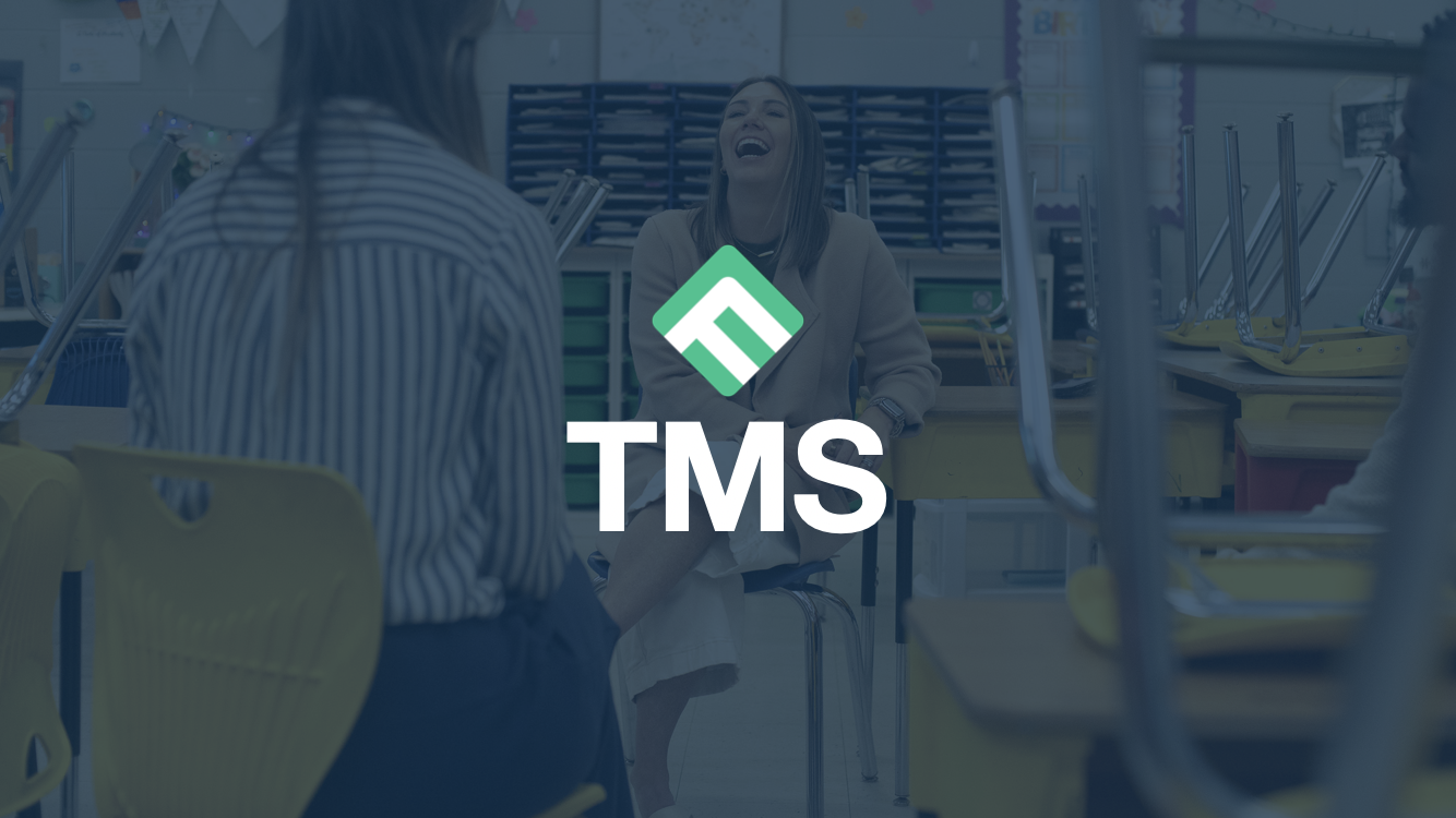 TMS showing a teacher laughing and chatting with others