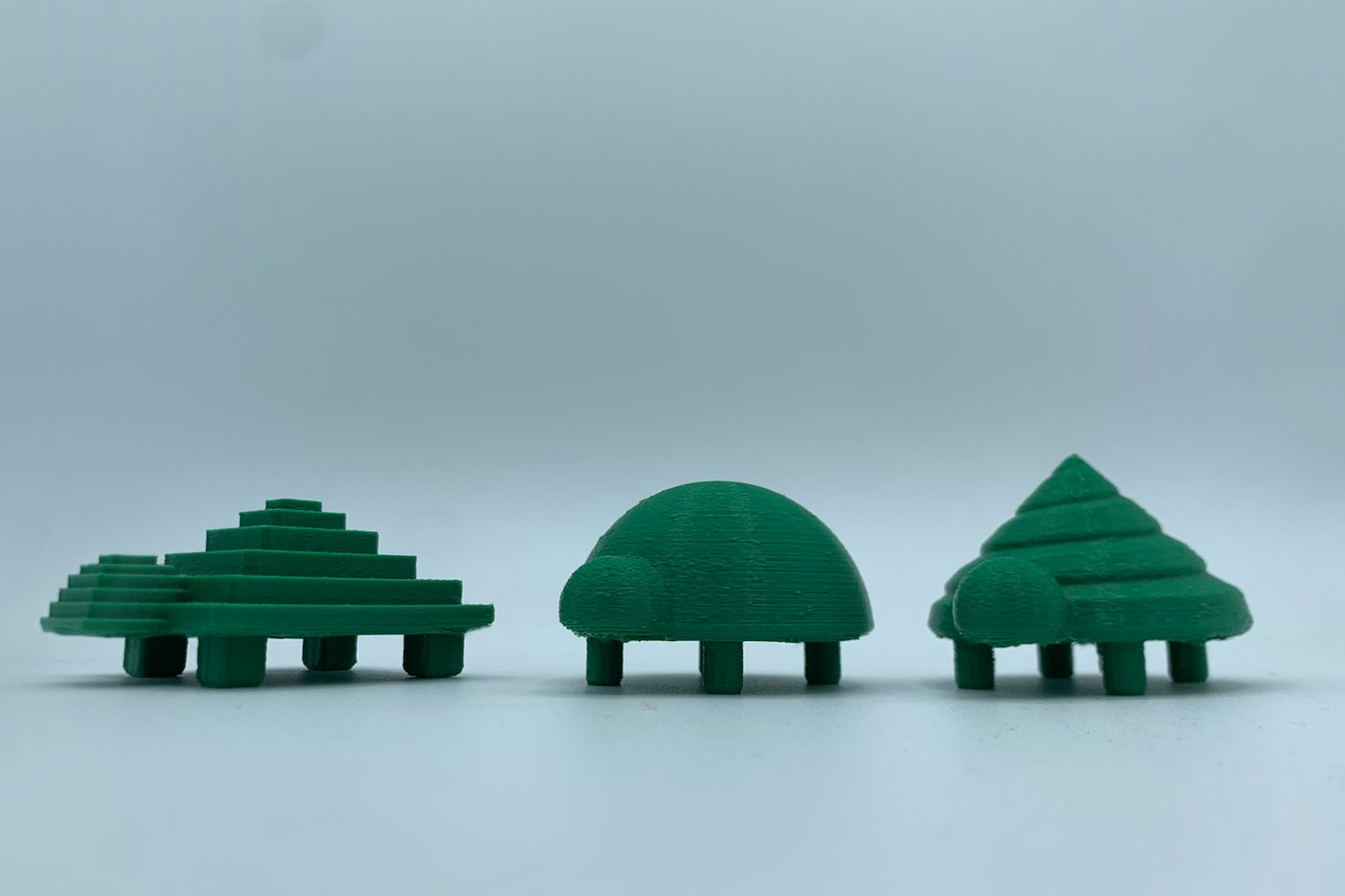 Three turtles: one round, one conical, and one stepped