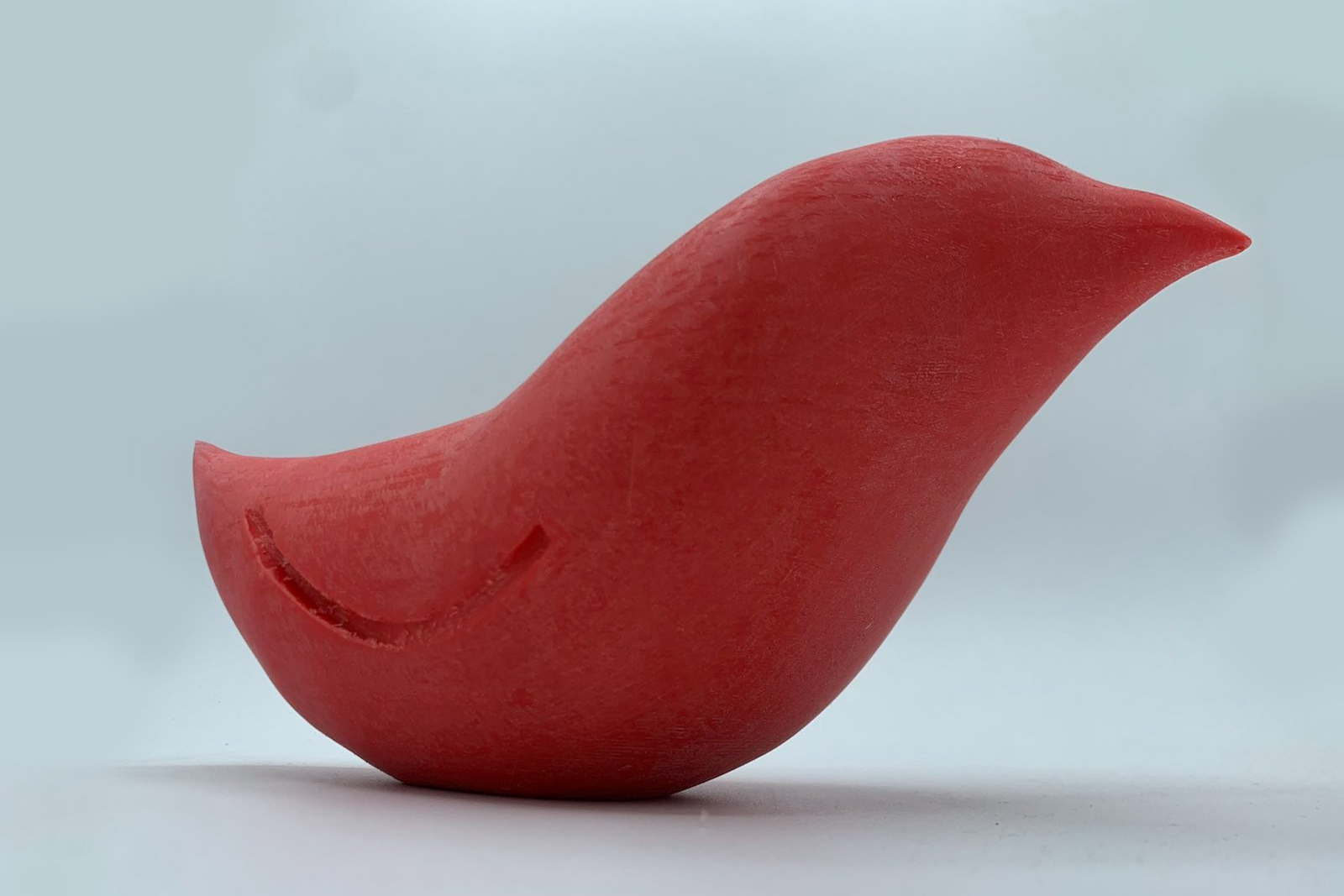 A red, smooth-sided bird made from a series of lofts