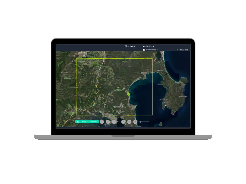 Laptop displaying FiSci's wildfire mitigation platform Mitigate, a map with a yellow project boundary box over a landscape featuring a lake, roads, and vegetation.