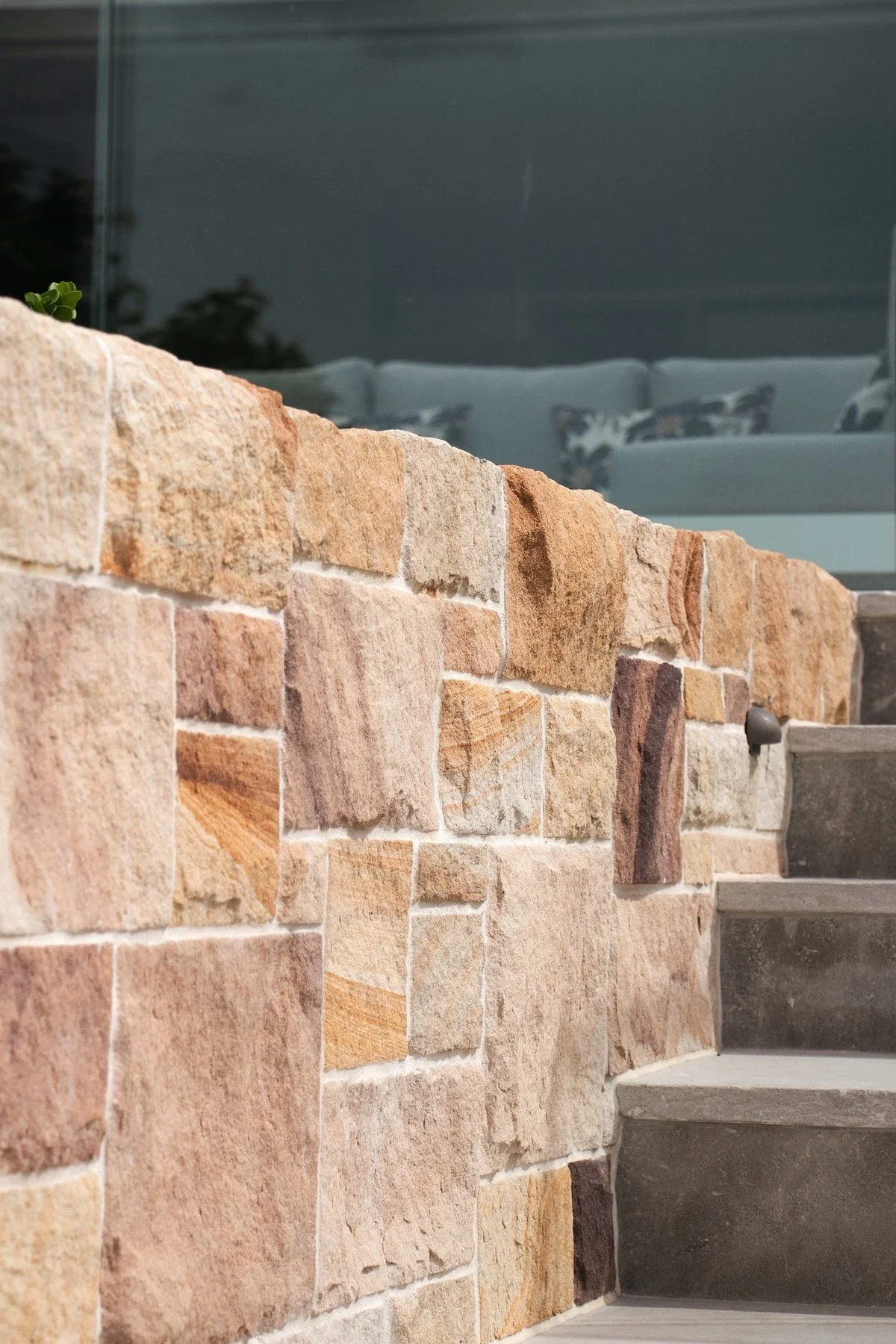 Close up of sandstone retaining wall and concrete stair detail in Sutherland Shire landscaping project