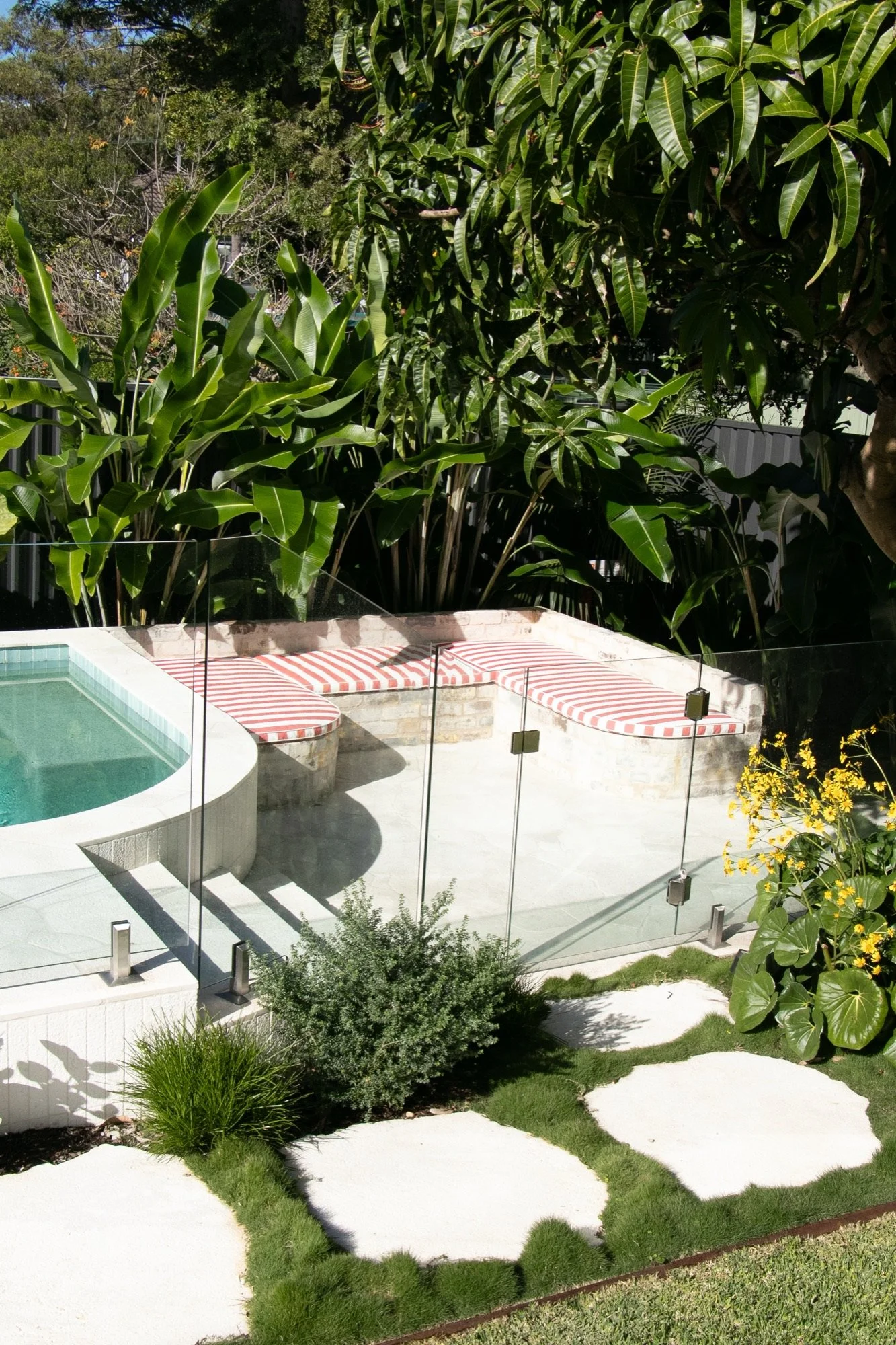 Stone steppers and planting leading past the poolside lounge in Chifley