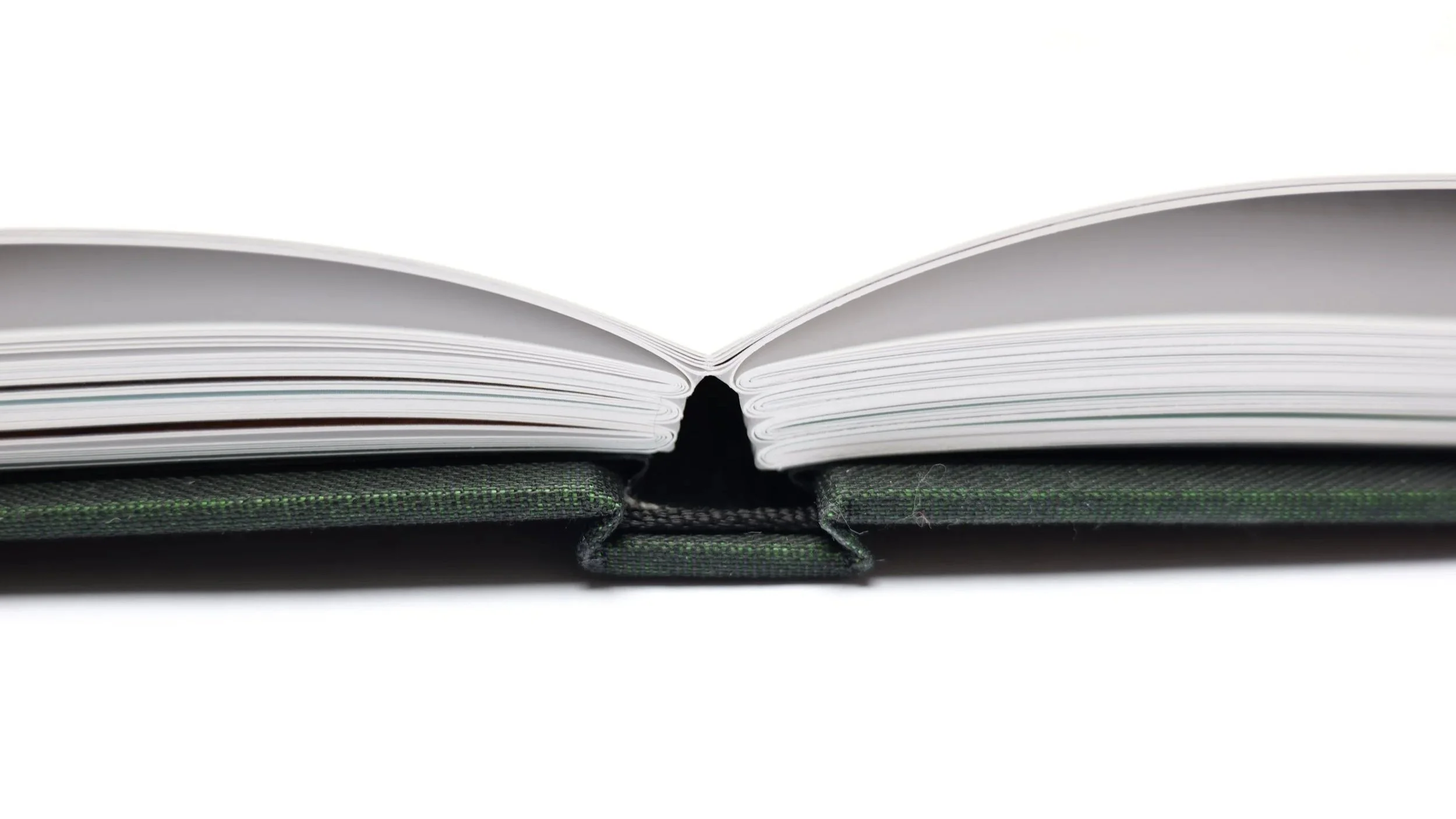 Section-sewn case binding with foiled and debossed spine, premium head and tail bands, cloth-covered boards