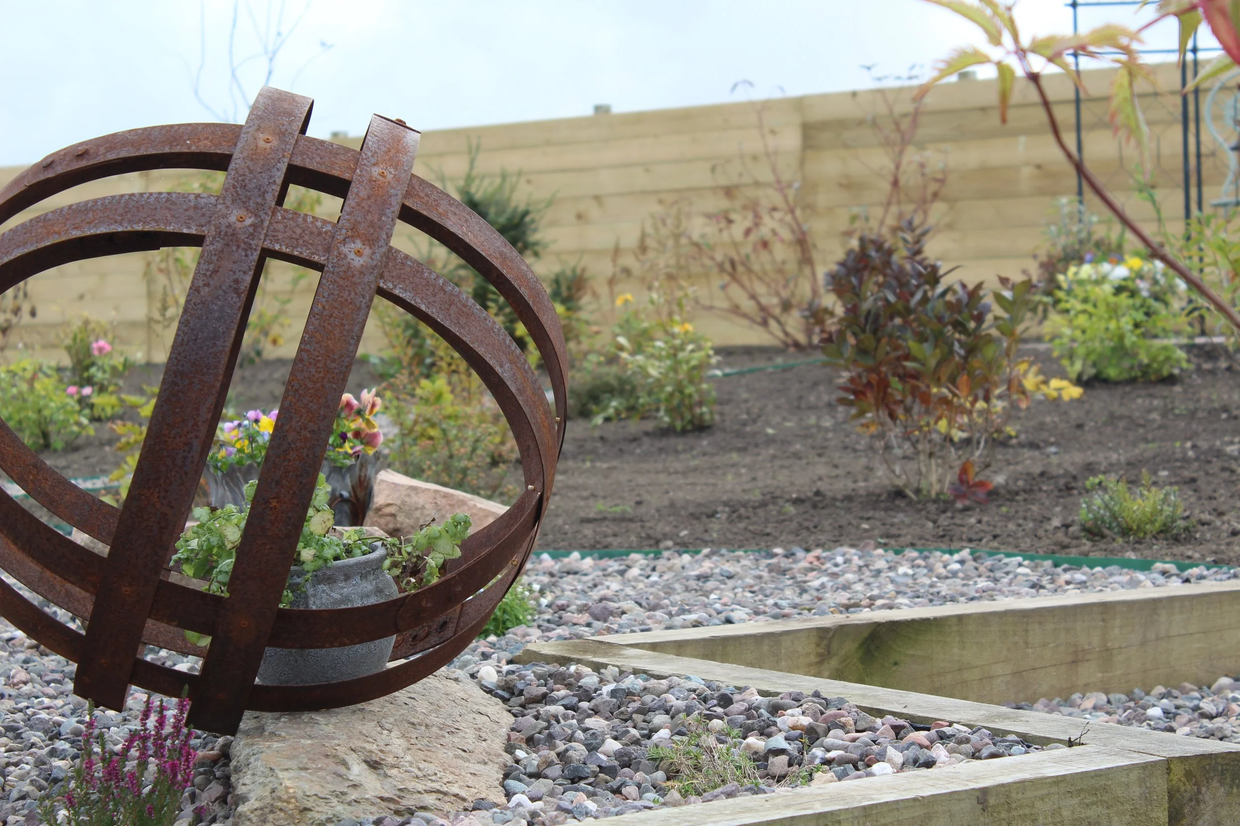 These steel spheres work beautifully as a feature in the rockery. We have added a spotlight in front of this to highlight the feature in the darker nights. 