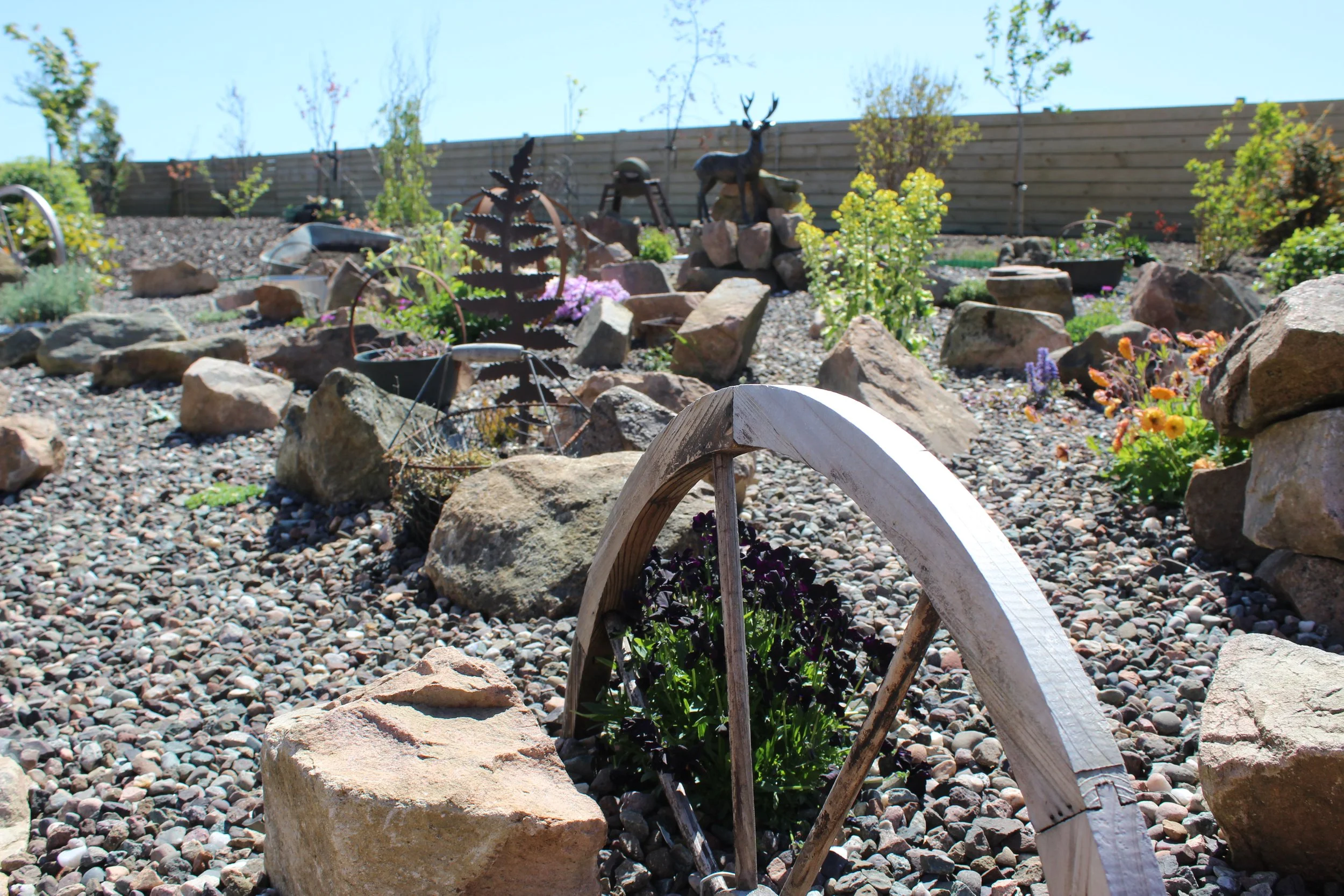 We added in wooden wheel features within the planting to add more interest. 