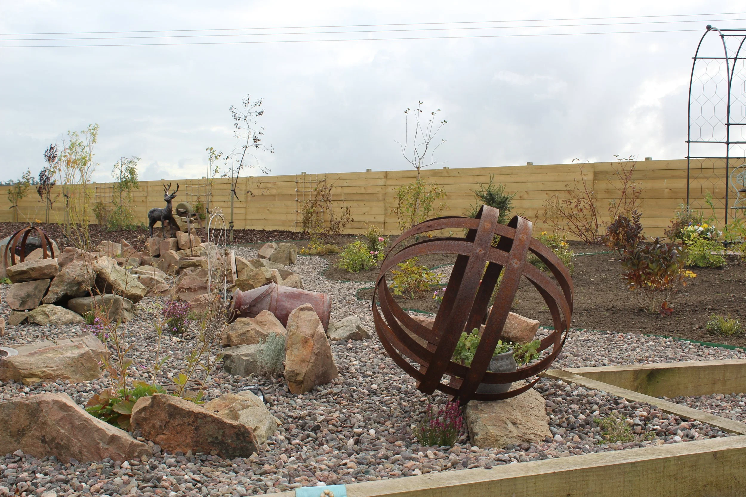 We used a mix of materials like gravel, steel, sleepers and bark to create this garden. 