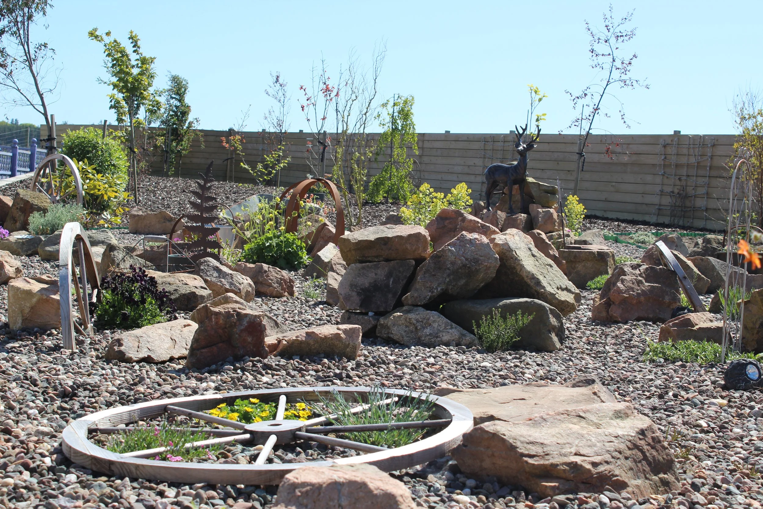 Lots of decorative elements were added into the rock garden to create a vintage feel to the space and to reflect the style of the house. 