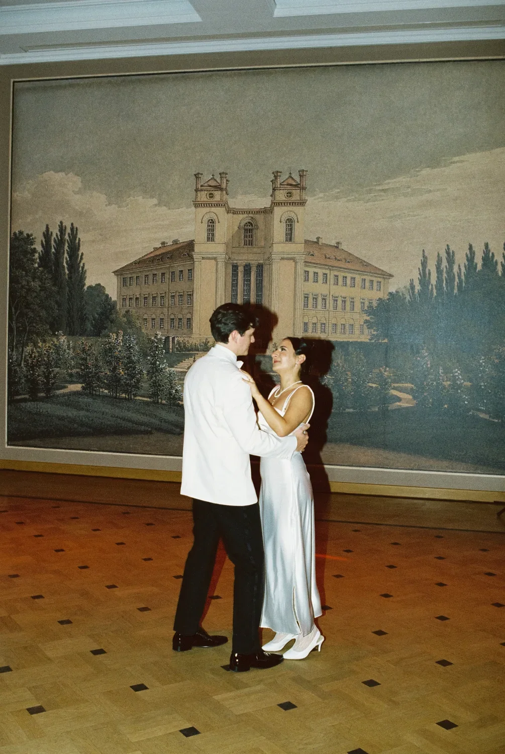 analog-wedding-first-dance-historic-mural.webp